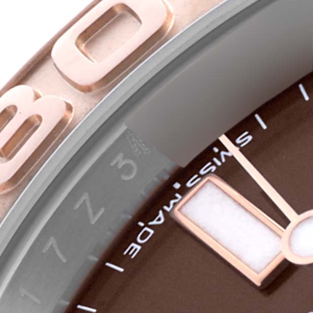 The image shows a close-up of the Rolex Yacht-Master 116621 Men's Steel and Gold (two tone) Brown Dial 116621 Men's Steel and Gold (two tone) Brown Dial's bezel and part of the dial, highlighting details like numerals and indices.