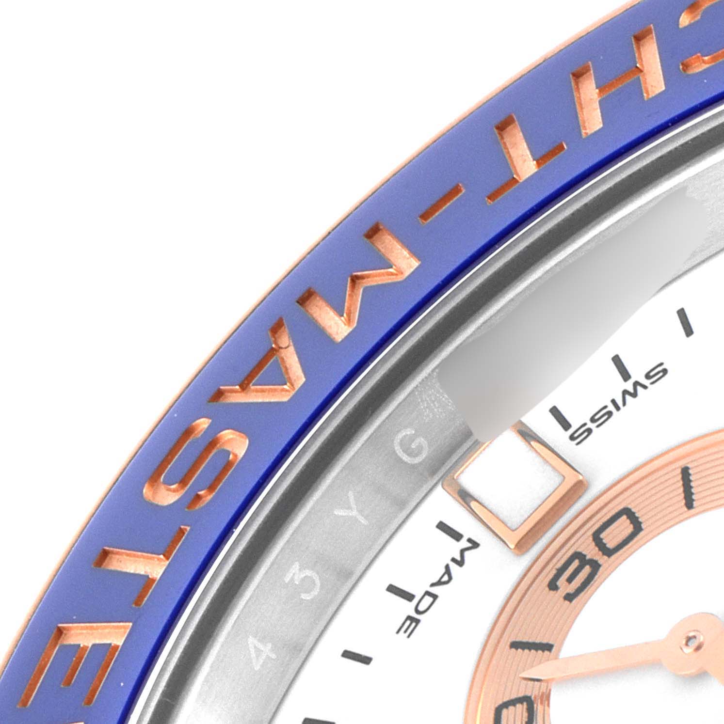 The image shows a close-up of the bezel, part of the dial, and a segment of the hands of a Rolex Yacht-Master 116681 Men's Stainless Steel White Dial 116681 Men's Stainless Steel White Dial watch.