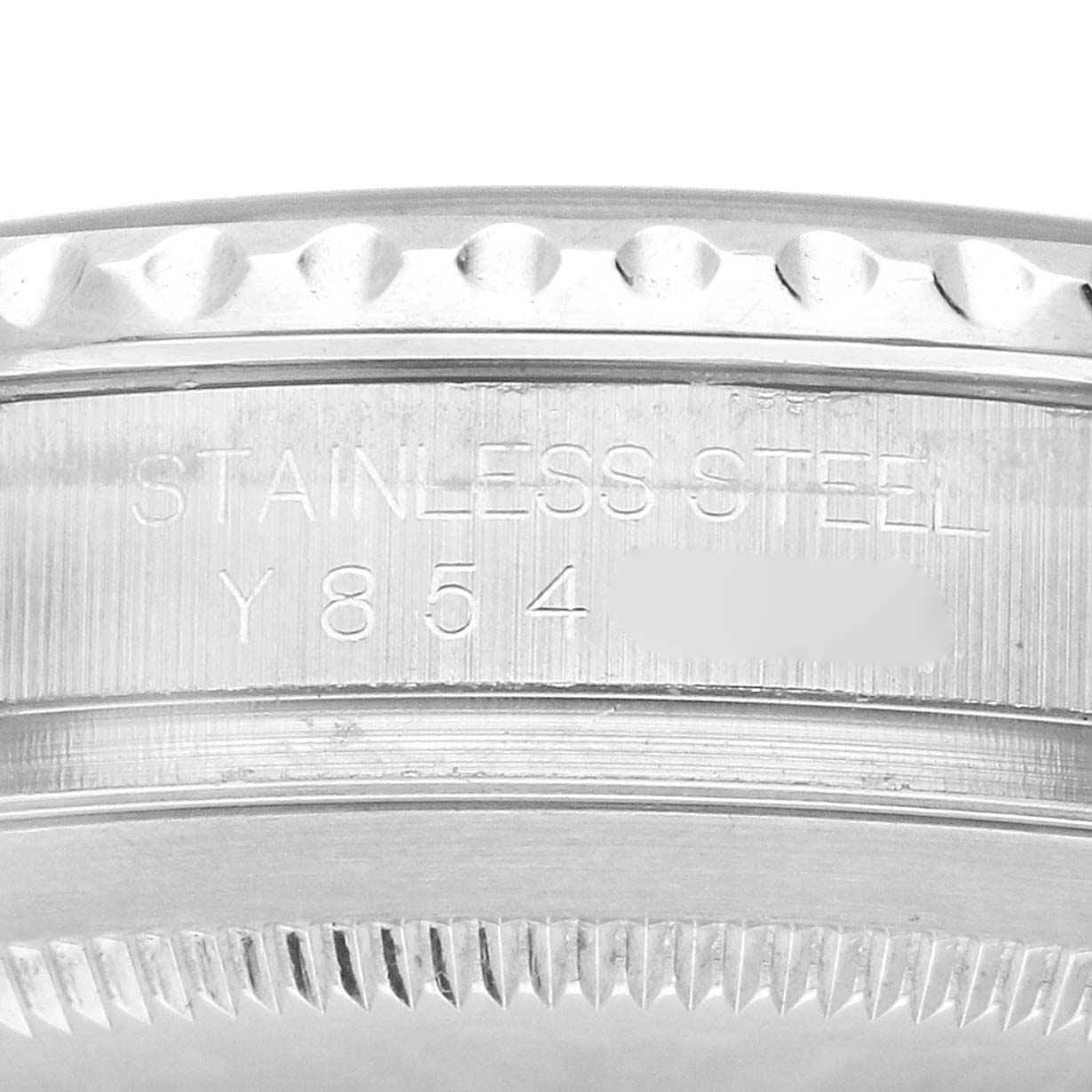 The image shows a close-up side view of the bezel and edge of the case of a Rolex Yacht-Master 16622 Men
s Stainless Steel Silver Dial 16622 Men
s Stainless Steel Silver Dial, highlighting the serial and material engraving.