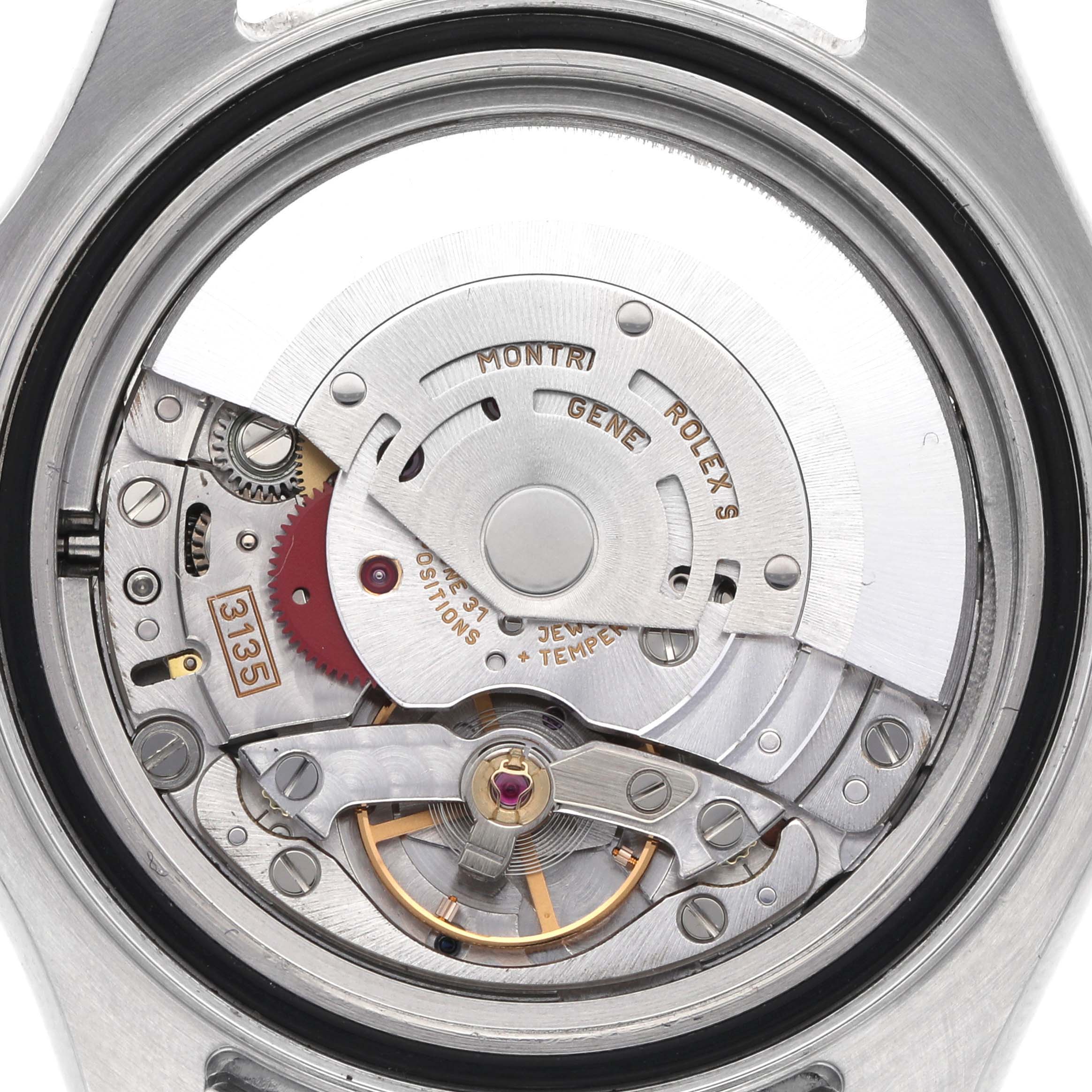 The image shows the movement of a Rolex Yacht-Master 16622 Men
s Stainless Steel Silver Dial 16622 Men
s Stainless Steel Silver Dial watch focused on the intricate internal mechanics.