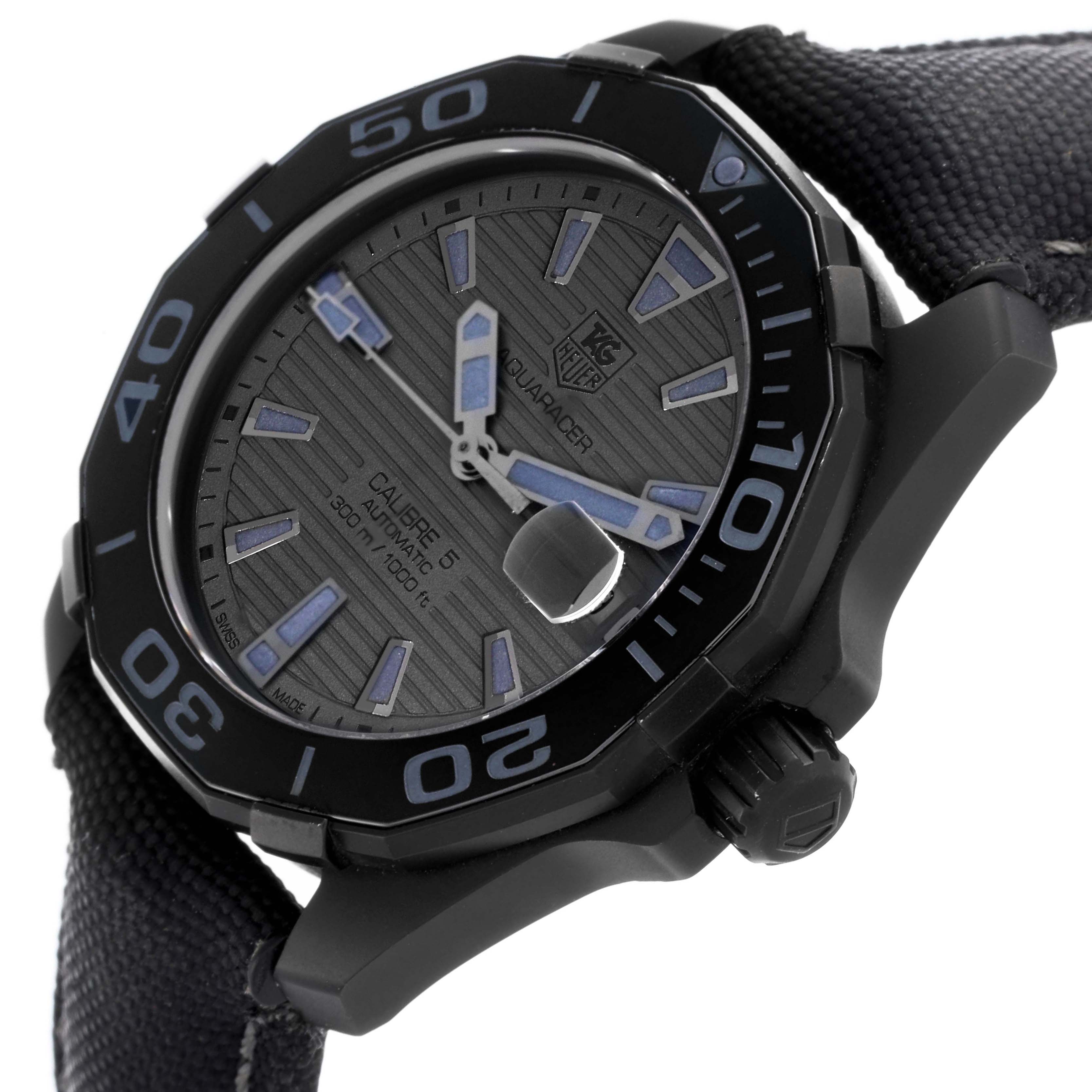 The Tag Heuer Aquaracer WAY218B.FC6364 Men's Stainless Steel Black Dial watch is shown from a low side angle, highlighting the dial, bezel, case, and strap connection.