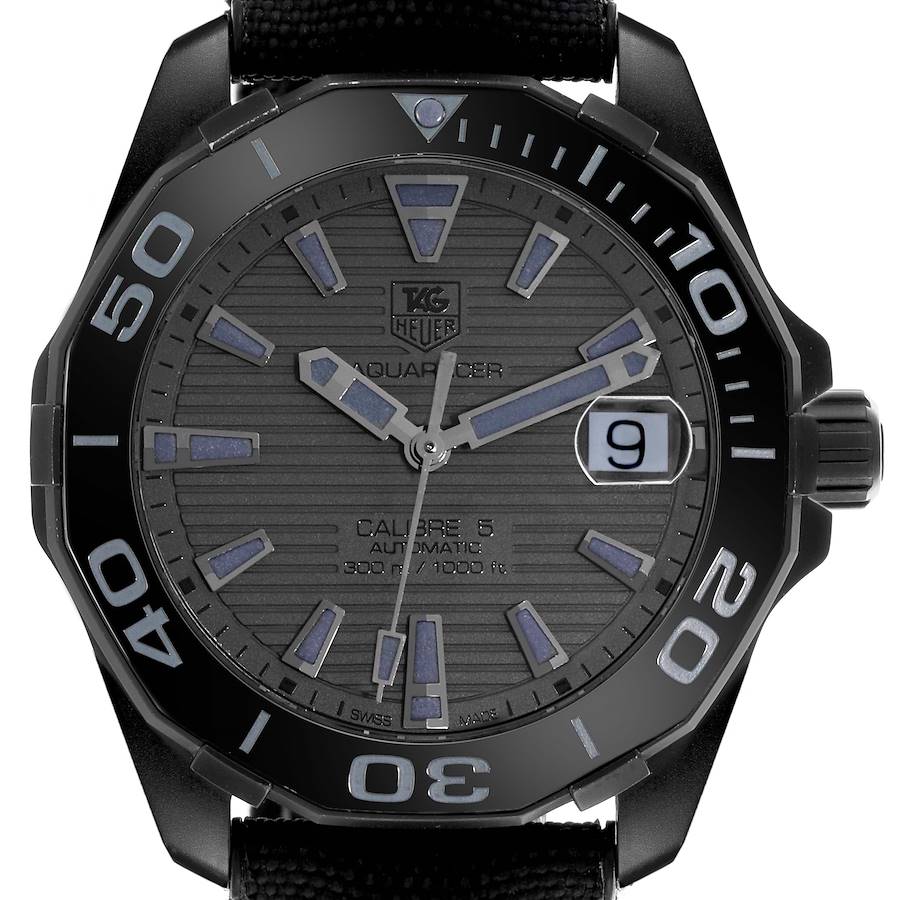 The image shows a front view of the TAG Heuer Aquaracer watch, highlighting the dial, hands, bezel, and date window.