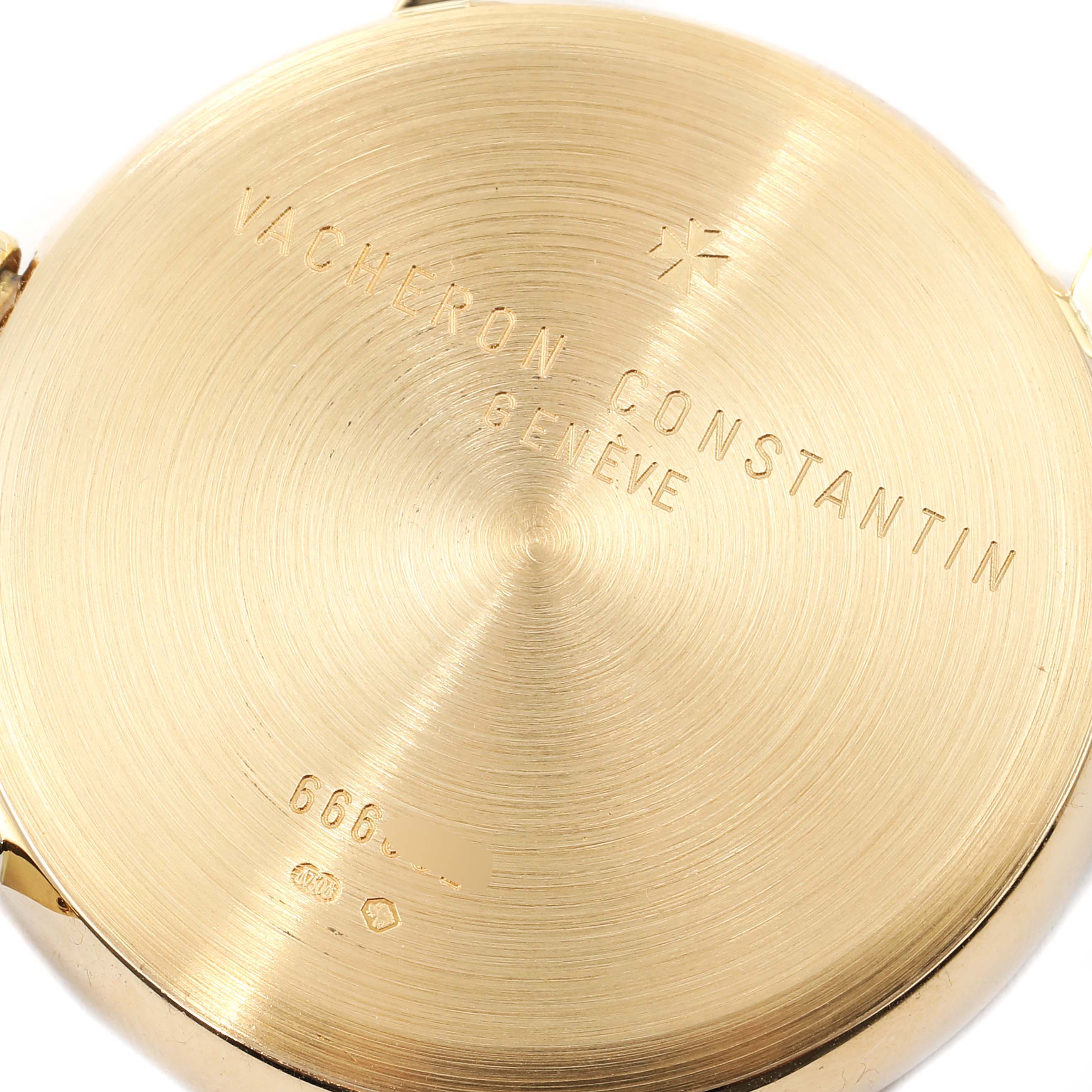 This image shows the back case of a Vacheron Constantin Patrimony 44001/3 Men's Yellow Gold White Dial 44001/3 Men's Yellow Gold White Dial watch, highlighting its engravings and brushed gold finish.