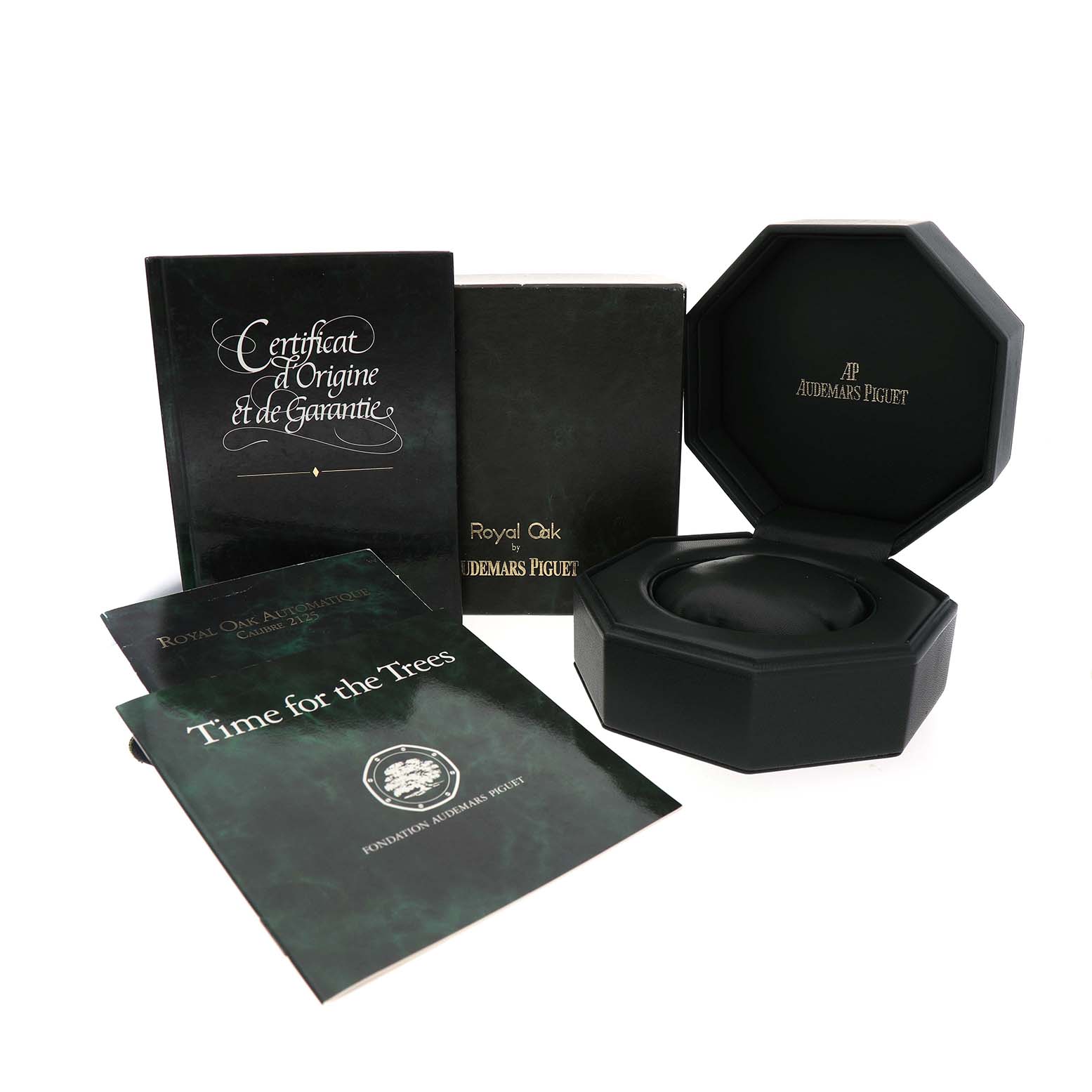 The image shows the Royal Oak by Audemars Piguet packaging with a box and documentation at an angled view.