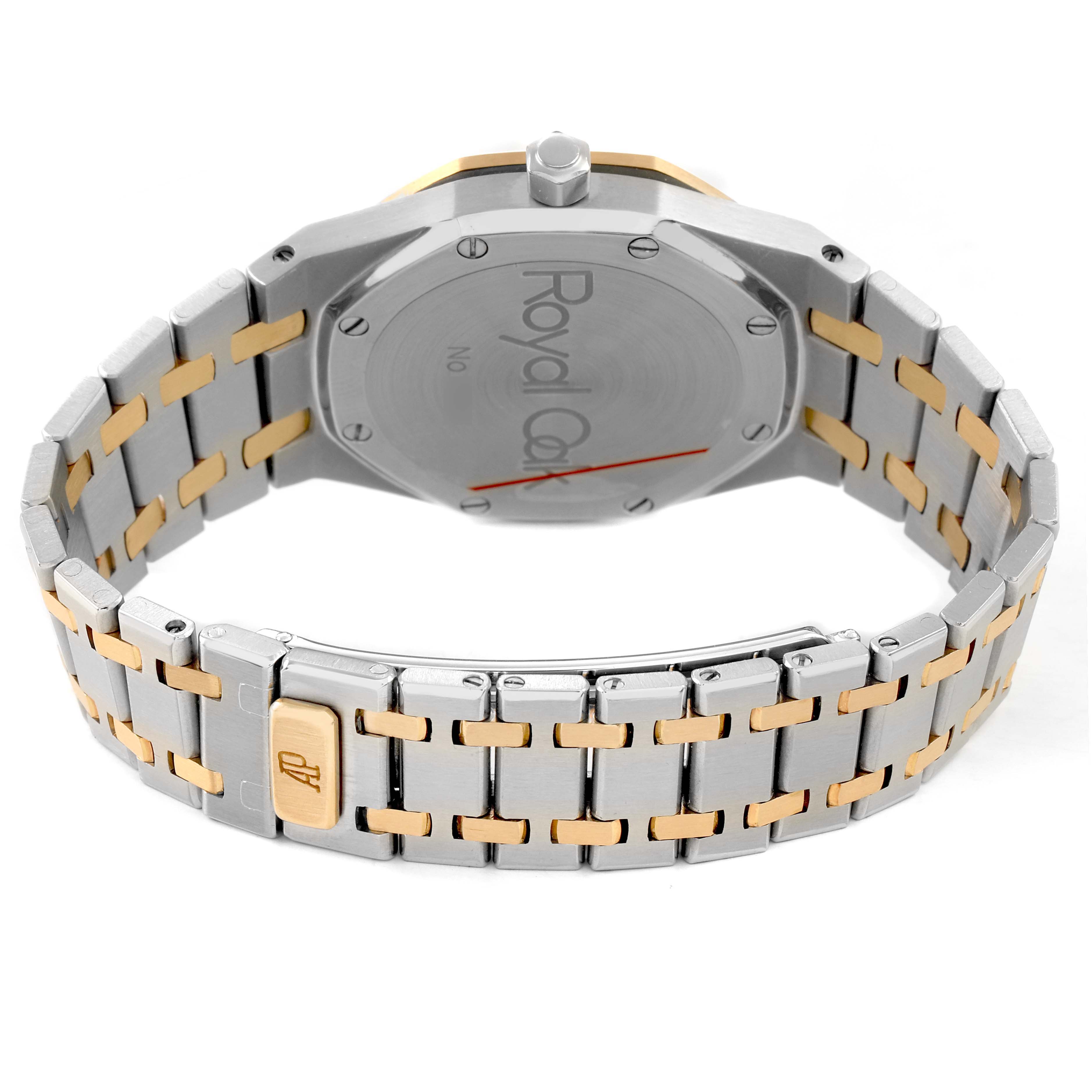 The image shows the back of the Audemars Piguet Royal Oak 14790SA.OO.0789SA.01 Men's Steel and Gold (two tone) Grey Dial watch, focusing on the case back and two-tone bracelet clasp.