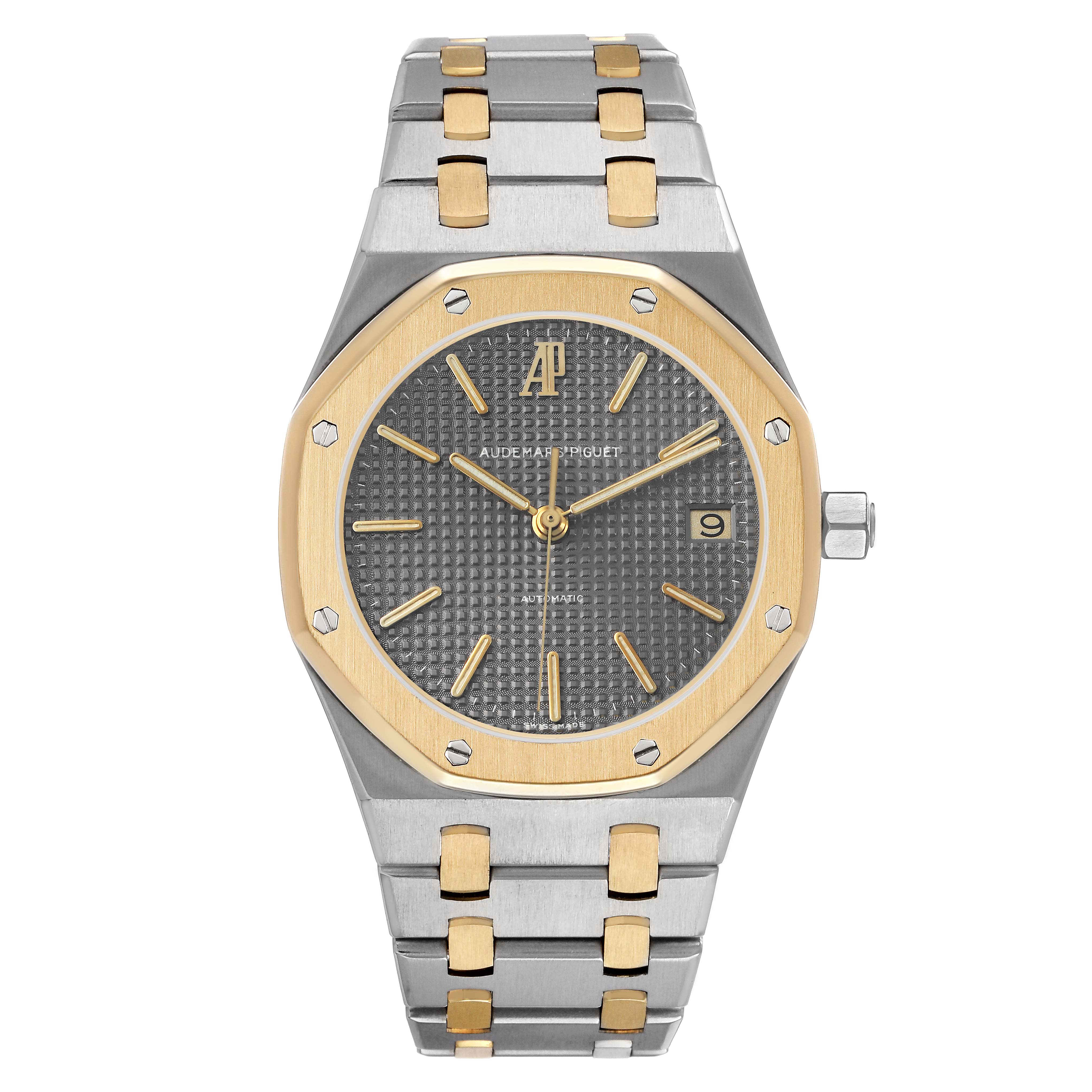 The Audemars Piguet Royal Oak 14790SA.OO.0789SA.01 Men's Steel and Gold (two tone) Grey Dial watch is shown from a top-down angle, highlighting the bezel, dial, bracelet, and crown.