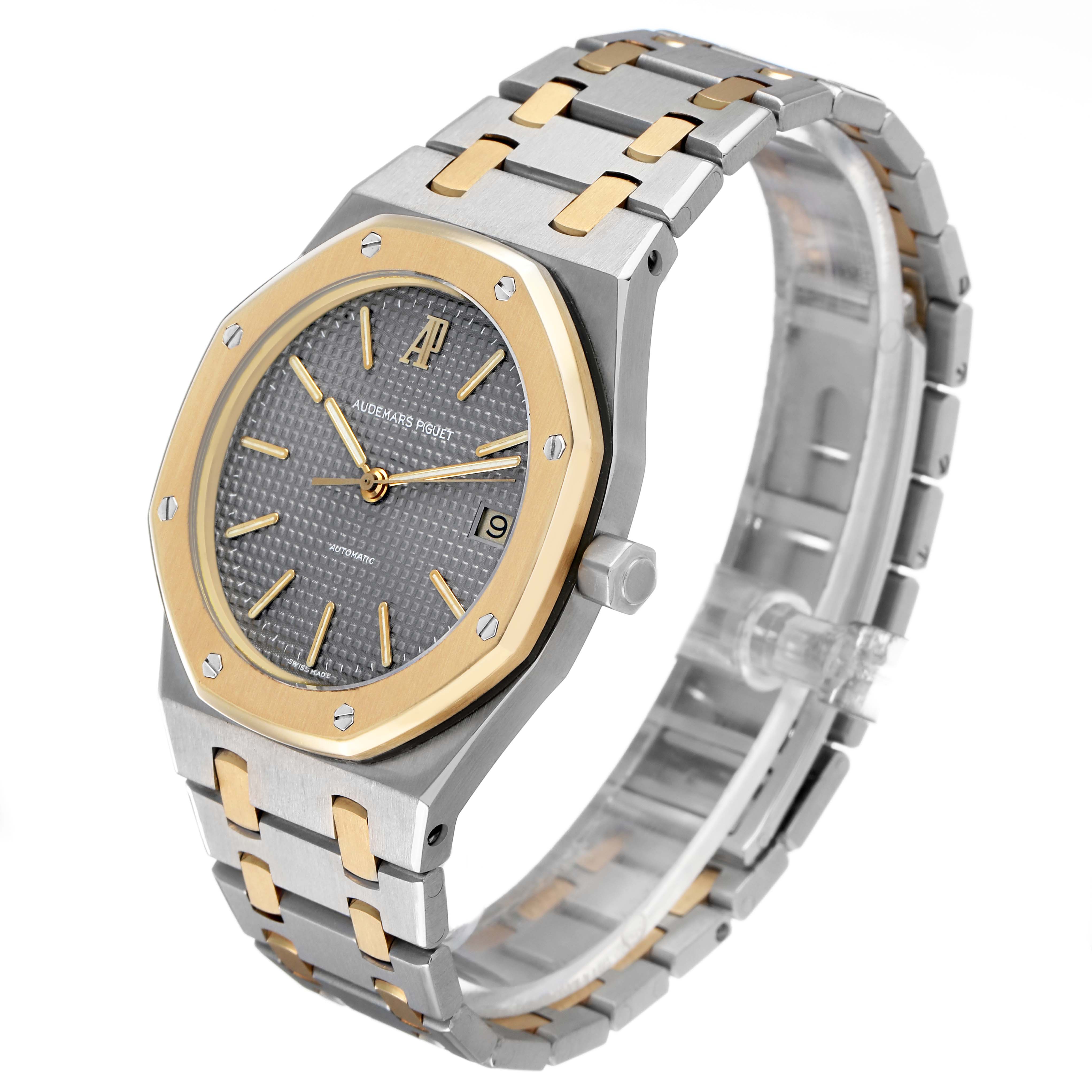 The Audemars Piguet Royal Oak 14790SA.OO.0789SA.01 Men's Steel and Gold (two tone) Grey Dial watch is shown at a three-quarter angle, displaying the dial, bezel, bracelet, and crown.