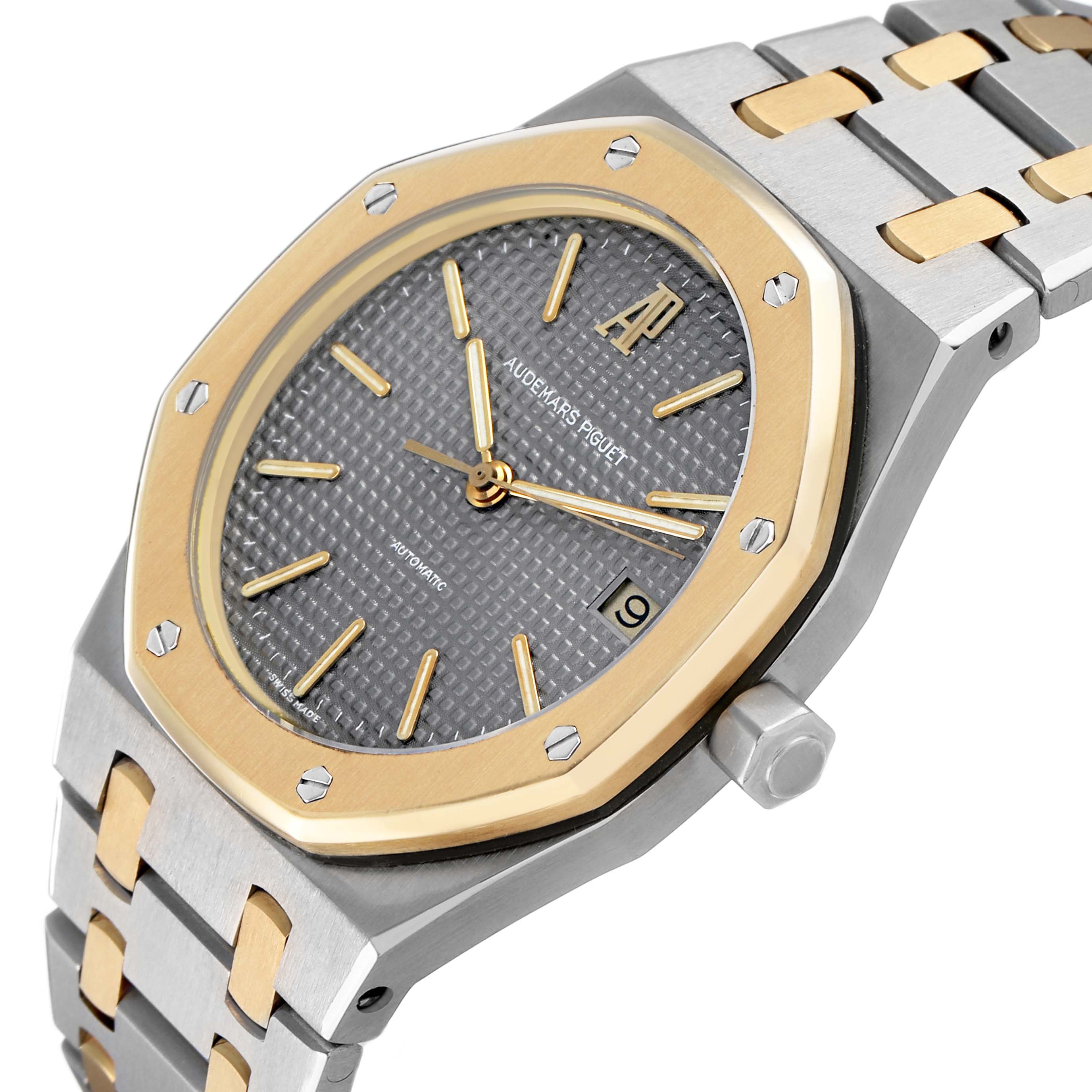 The Audemars Piguet Royal Oak 14790SA.OO.0789SA.01 Men's Steel and Gold (two tone) Grey Dial watch is shown at an angled view, highlighting the bezel, dial, crown, and bracelet.