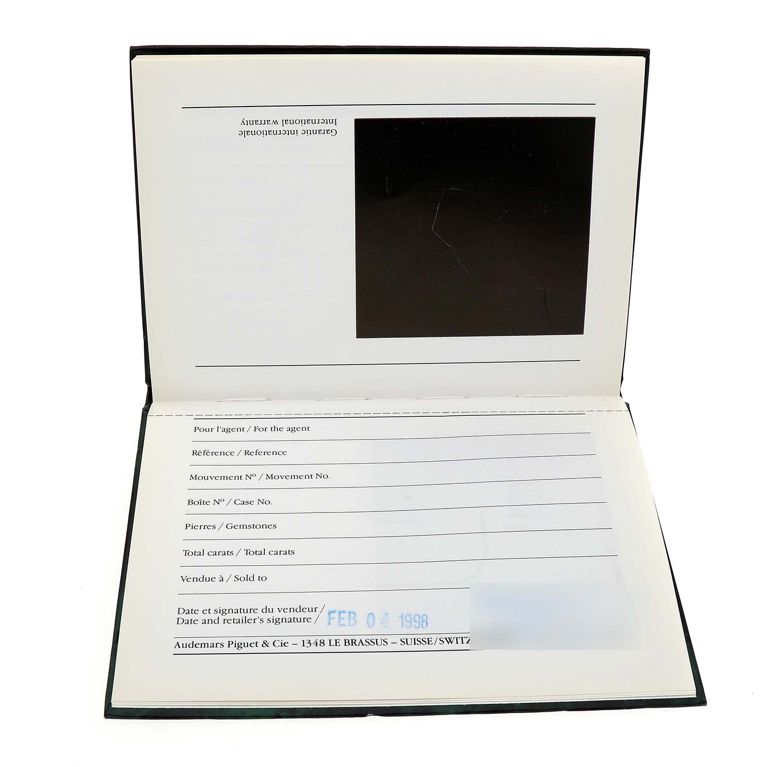 The image shows the warranty card booklet of an Audemars Piguet Royal Oak 14790SA.OO.0789SA.01 Men's Steel and Gold (two tone) Grey Dial watch, featuring sections for details and a date stamp.