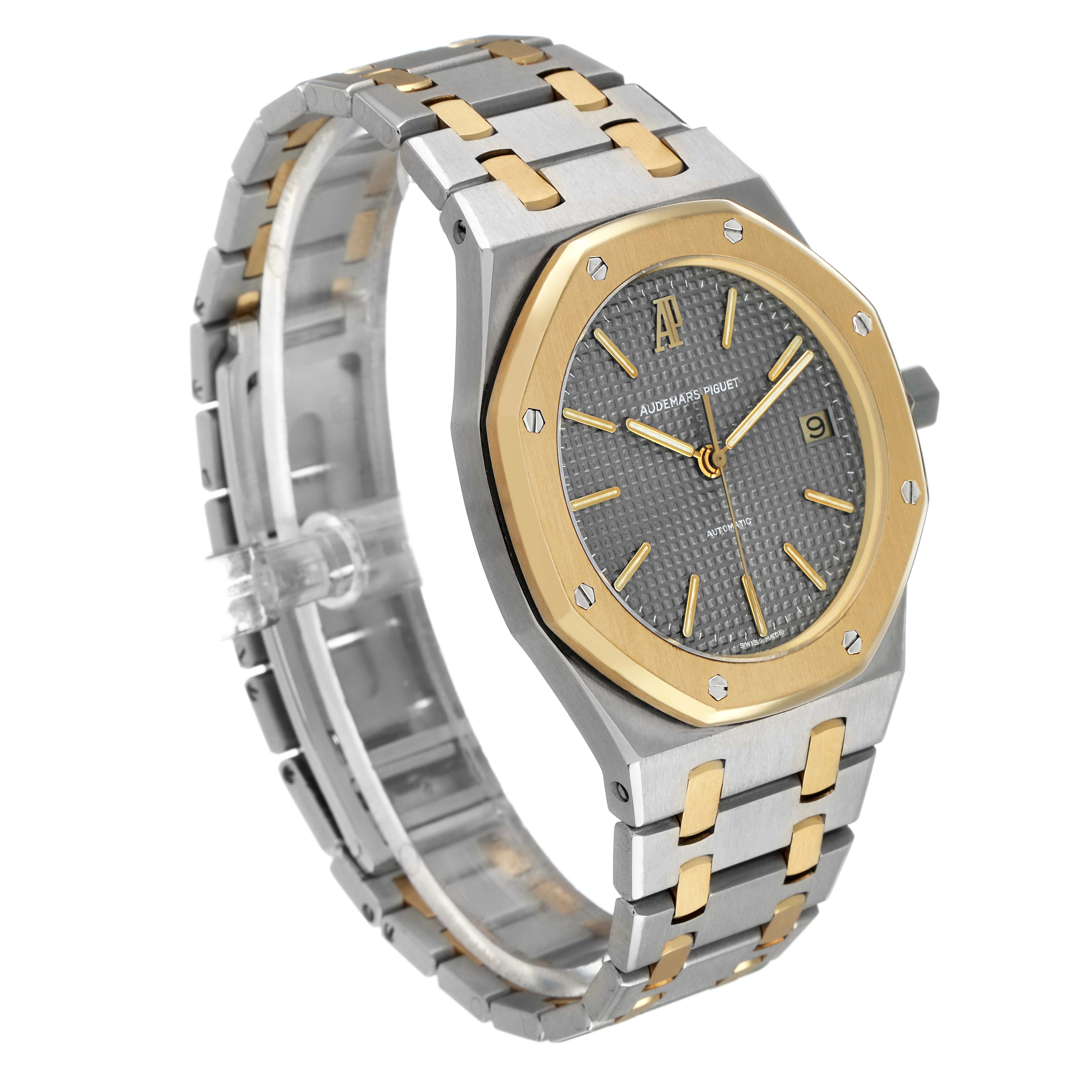 The Audemars Piguet Royal Oak 14790SA.OO.0789SA.01 Men's Steel and Gold (two tone) Grey Dial watch is shown at a three-quarter angle highlighting its gold and silver bracelet and octagonal bezel.