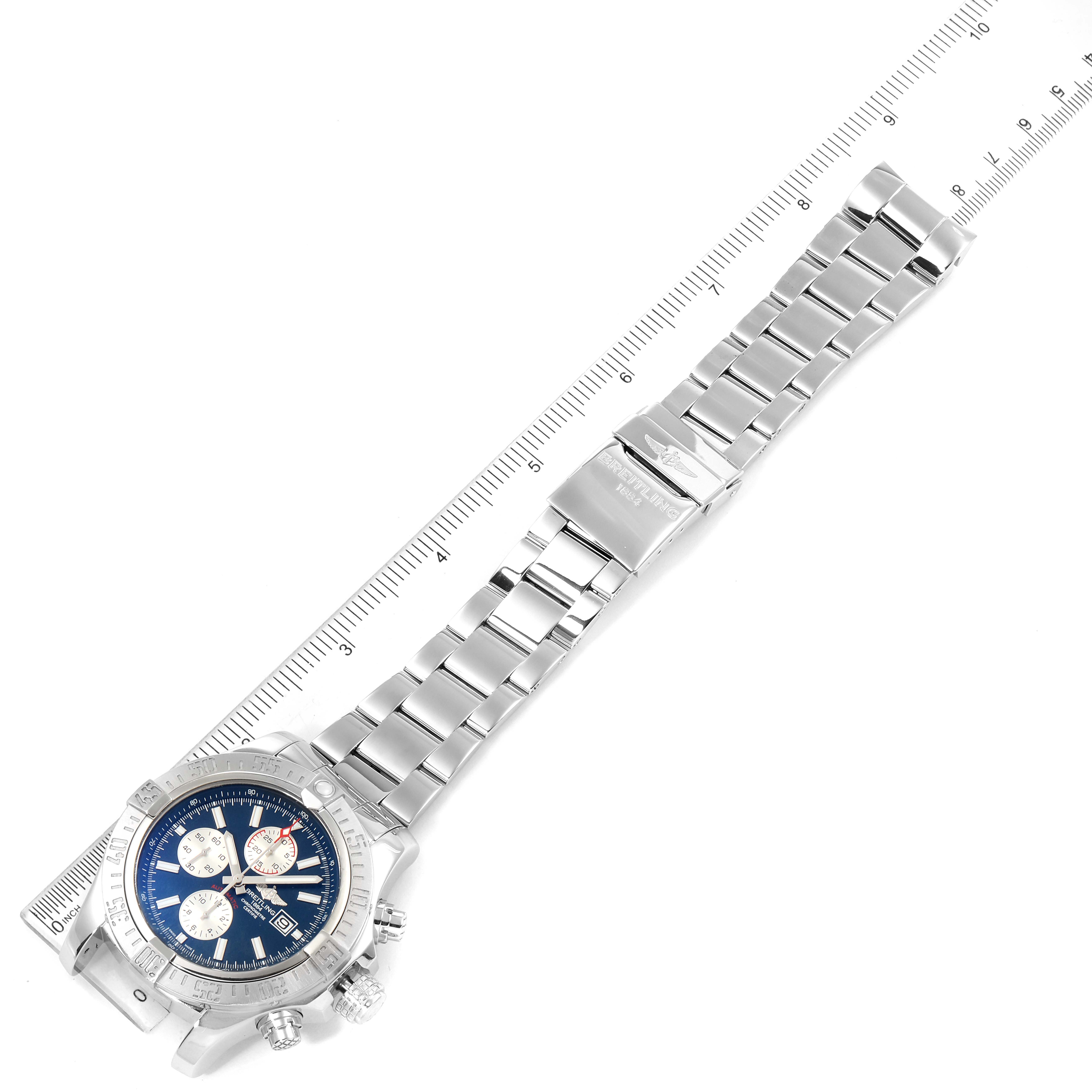 The image shows a Breitling Avenger A13371 Men's Stainless Steel Blue Dial A13371 Men's Stainless Steel Blue Dial watch from a top-down angle, including the watch face, bracelet, and clasp.