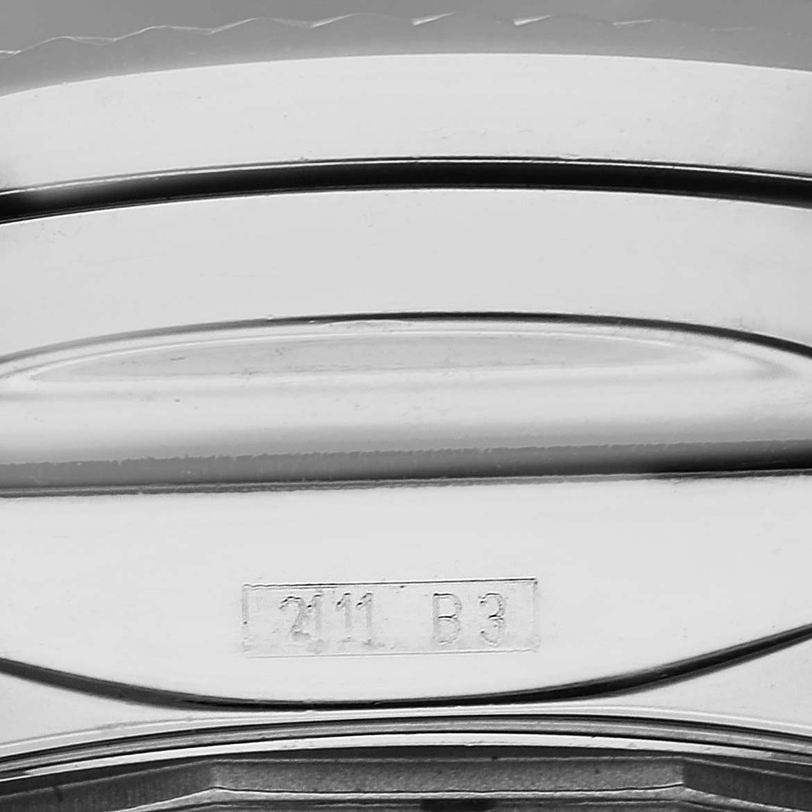 The image shows the side view of the casing with the engraved model number for a Bentley watch by Breitling.