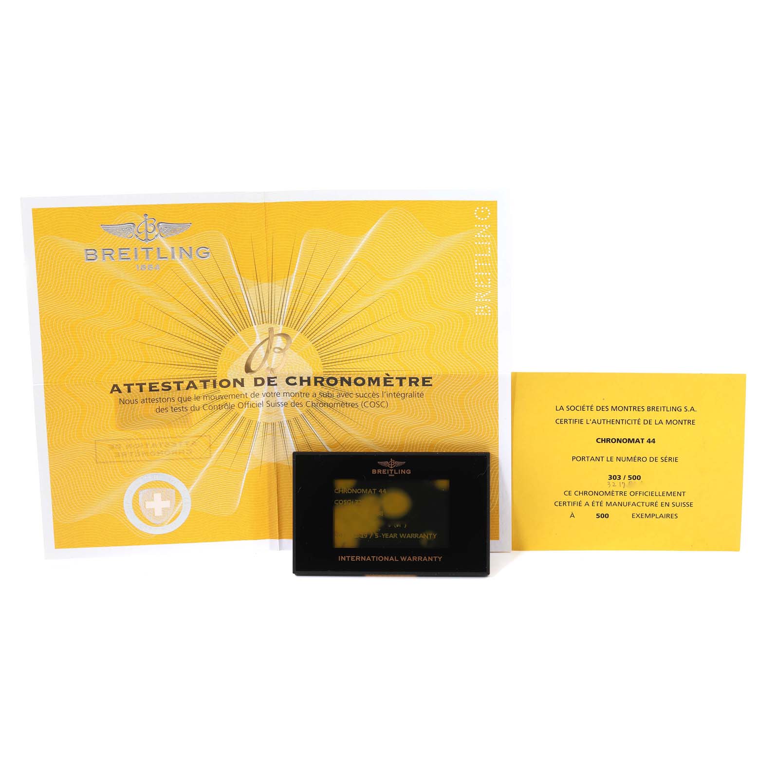 The image shows the certificates and warranty card for the Breitling Limited Series Chronomat 44 watch, displayed flat.