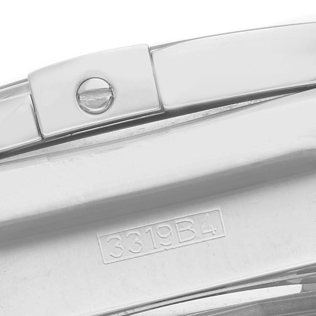 The image shows a close-up of the clasp and bracelet link of a Breitling Chronomat AB0115 Men's Stainless Steel Mother of Pearl Dial watch.