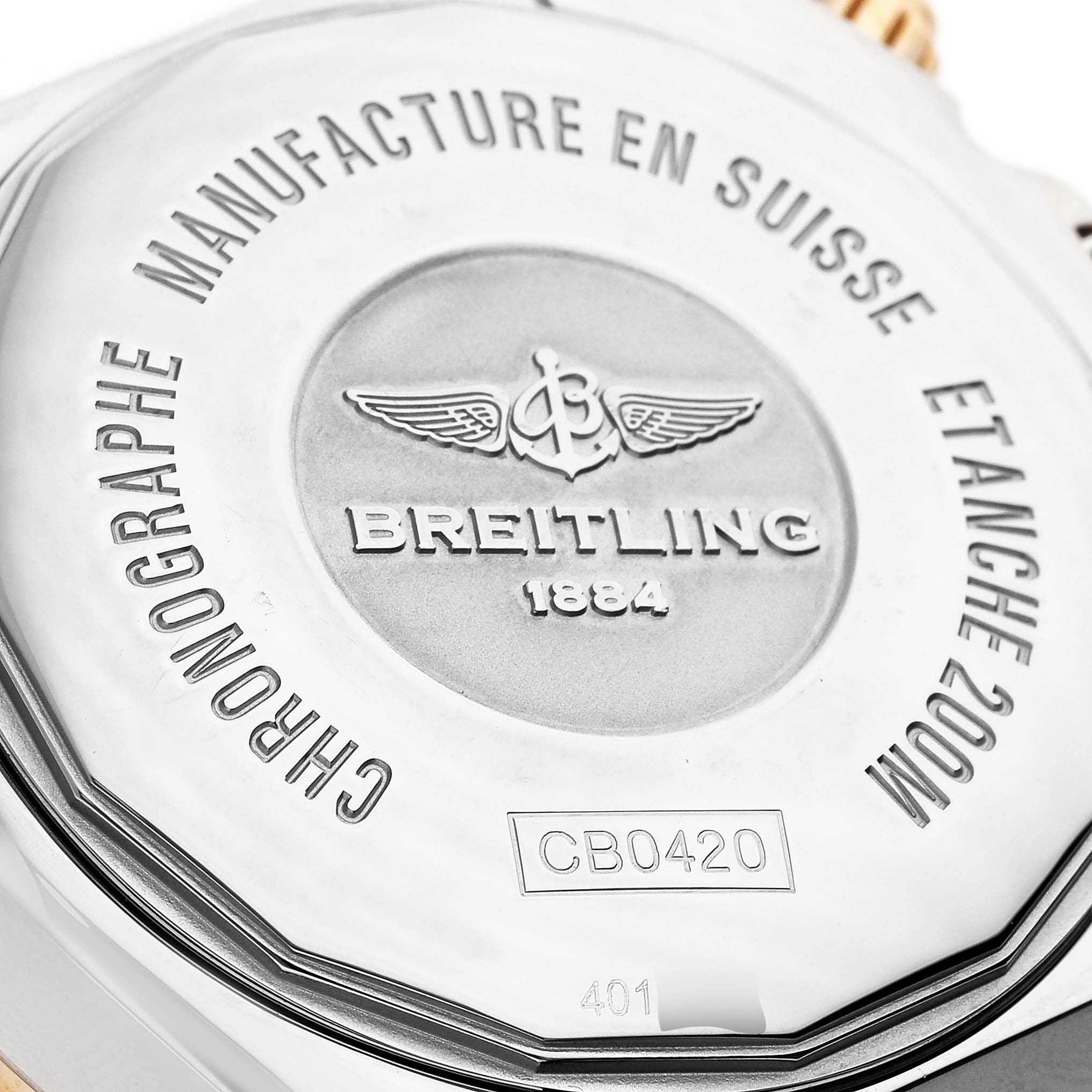 The image shows the back case of a Breitling Chronomat CB042012/Q590 Men's Stainless Steel Brown Dial watch, highlighting the brand logo and model details.