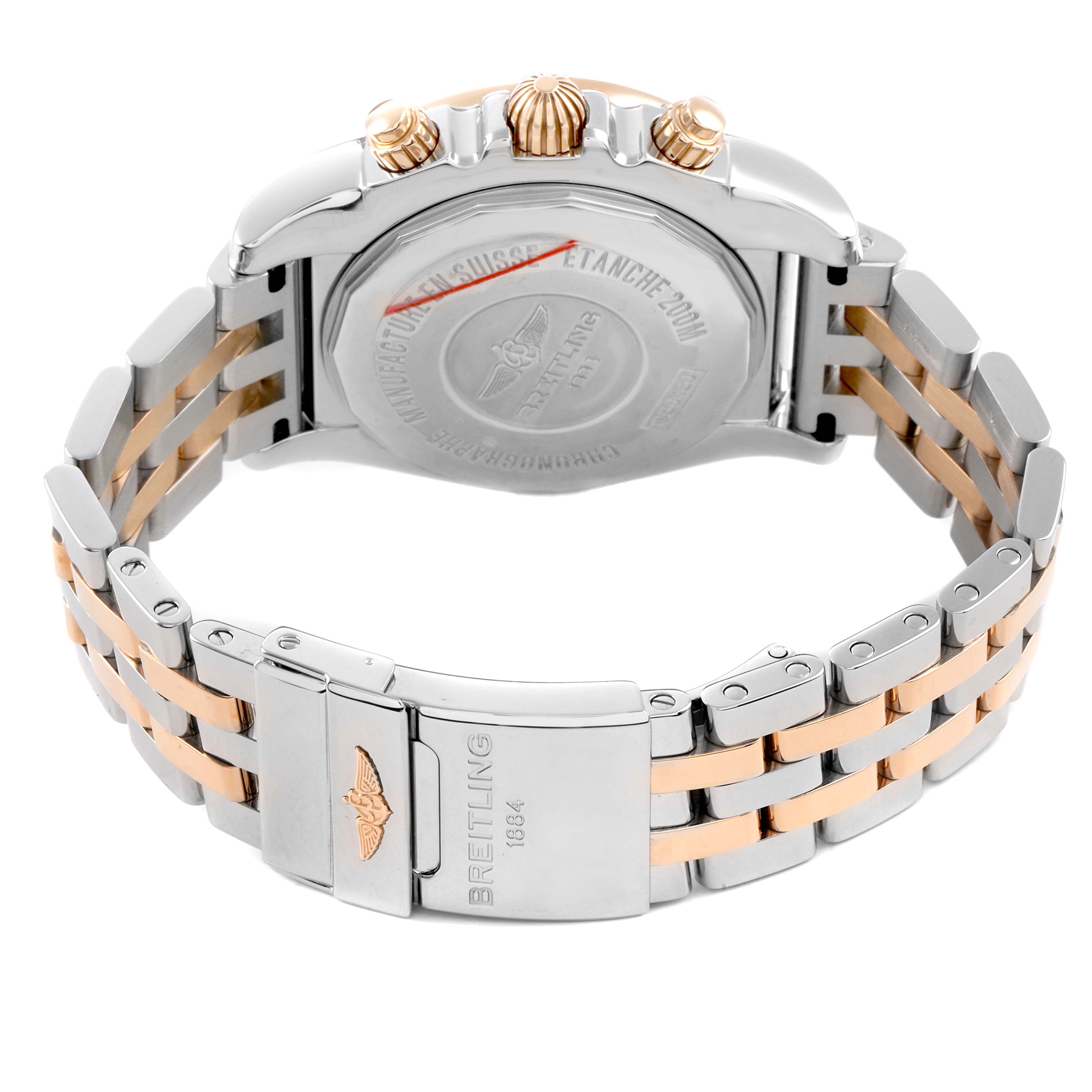 The image shows the back and clasp of a Breitling Chronomat CB042012/Q590 Men's Stainless Steel Brown Dial watch, highlighting the bracelet and case back details.