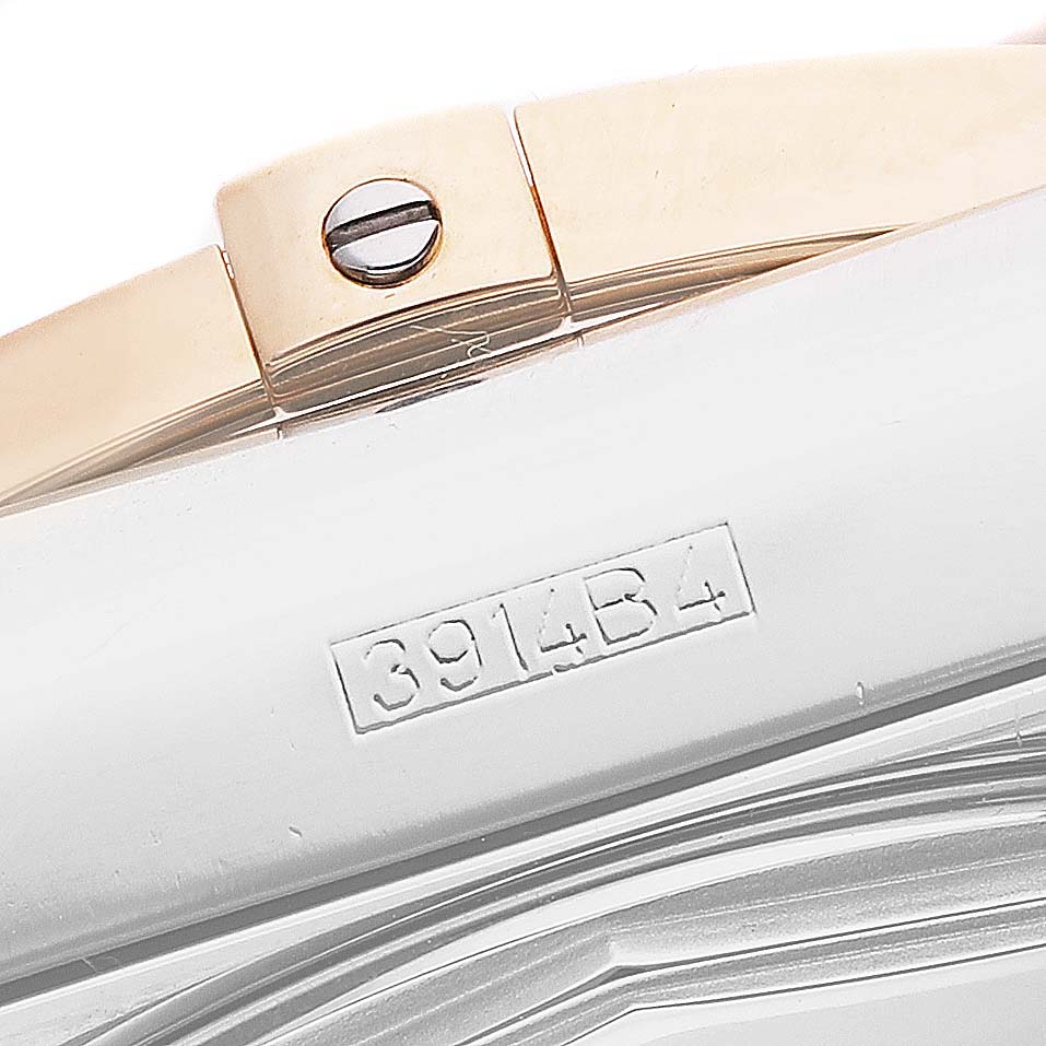 The image shows a close-up side view of a Breitling Chronomat CB042012/Q590 Men's Stainless Steel Brown Dial model watch, highlighting a part of the bracelet and clasp.