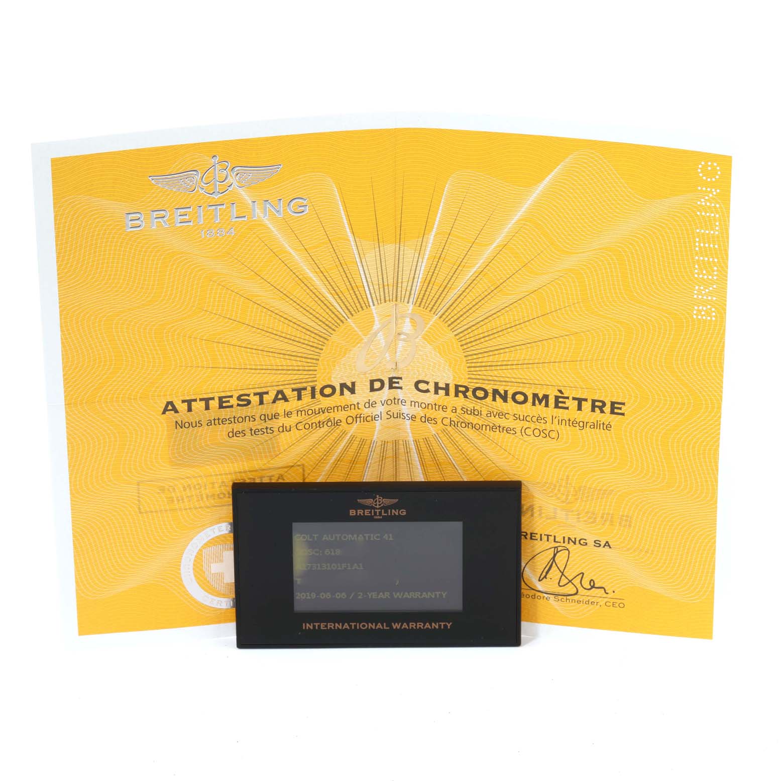 The image shows a Breitling Colt A17313 Men's Stainless Steel Grey Dial A17313 Men's Stainless Steel Grey Dial model certificate and an international warranty card placed on top.