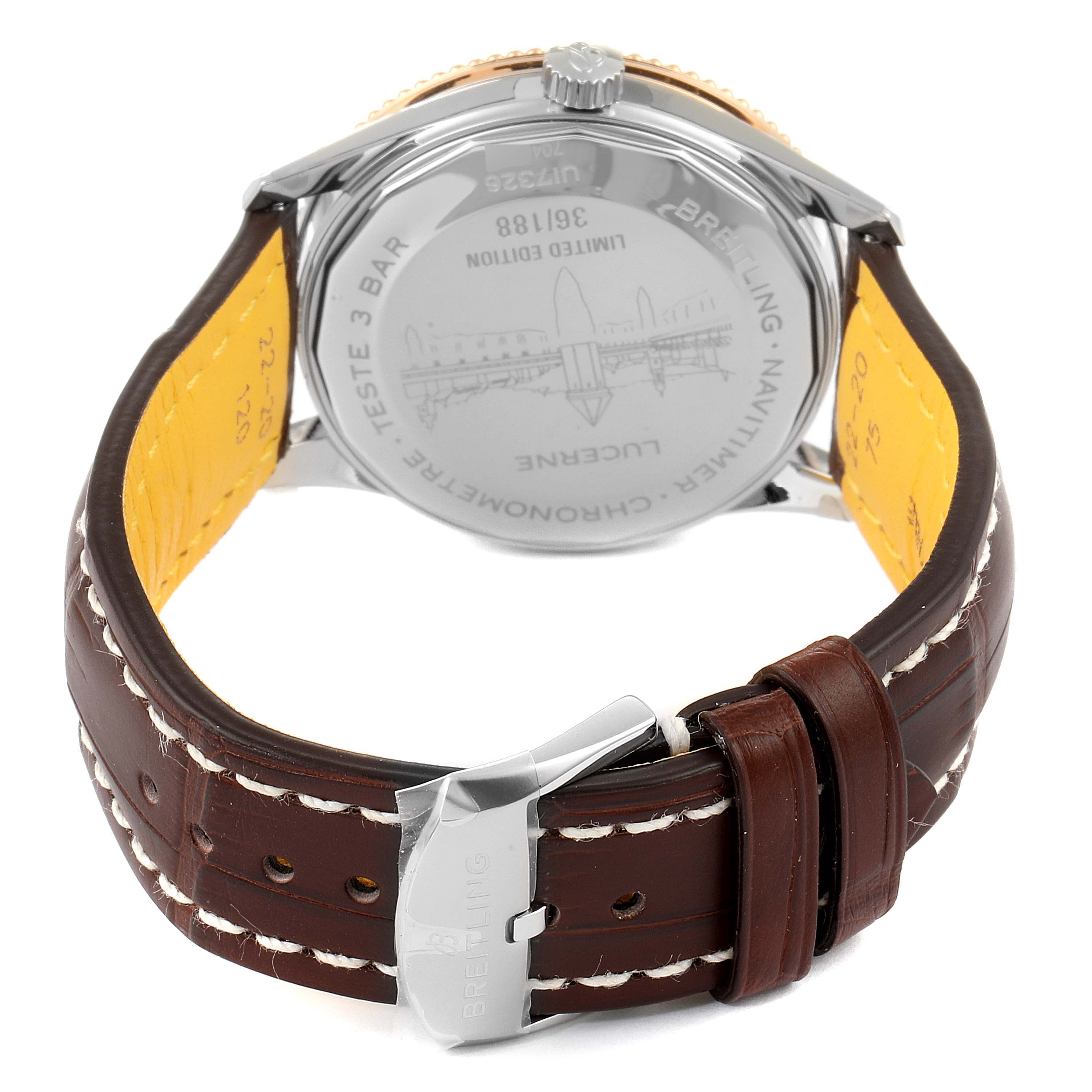 The image shows the back and clasp of a Breitling Navitimer U17326211M1P1 Men's Steel and Gold (two tone) Grey Dial U17326211M1P1 Men's Steel and Gold (two tone) Grey Dial watch, highlighting its leather strap and engraved case back.
