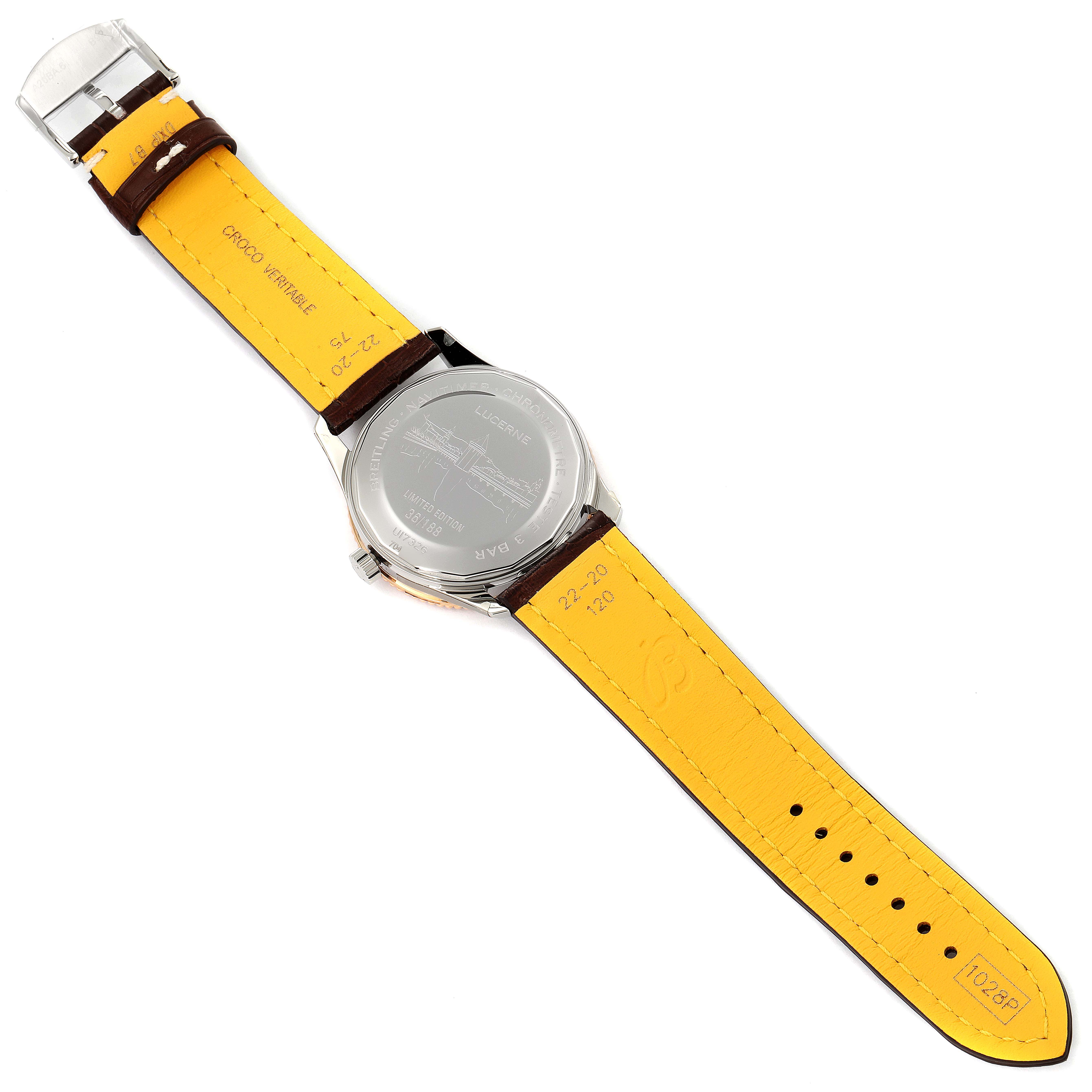 The image shows the back view of a Breitling Navitimer U17326211M1P1 Men's Steel and Gold (two tone) Grey Dial U17326211M1P1 Men's Steel and Gold (two tone) Grey Dial watch, displaying its case back and yellow leather strap.