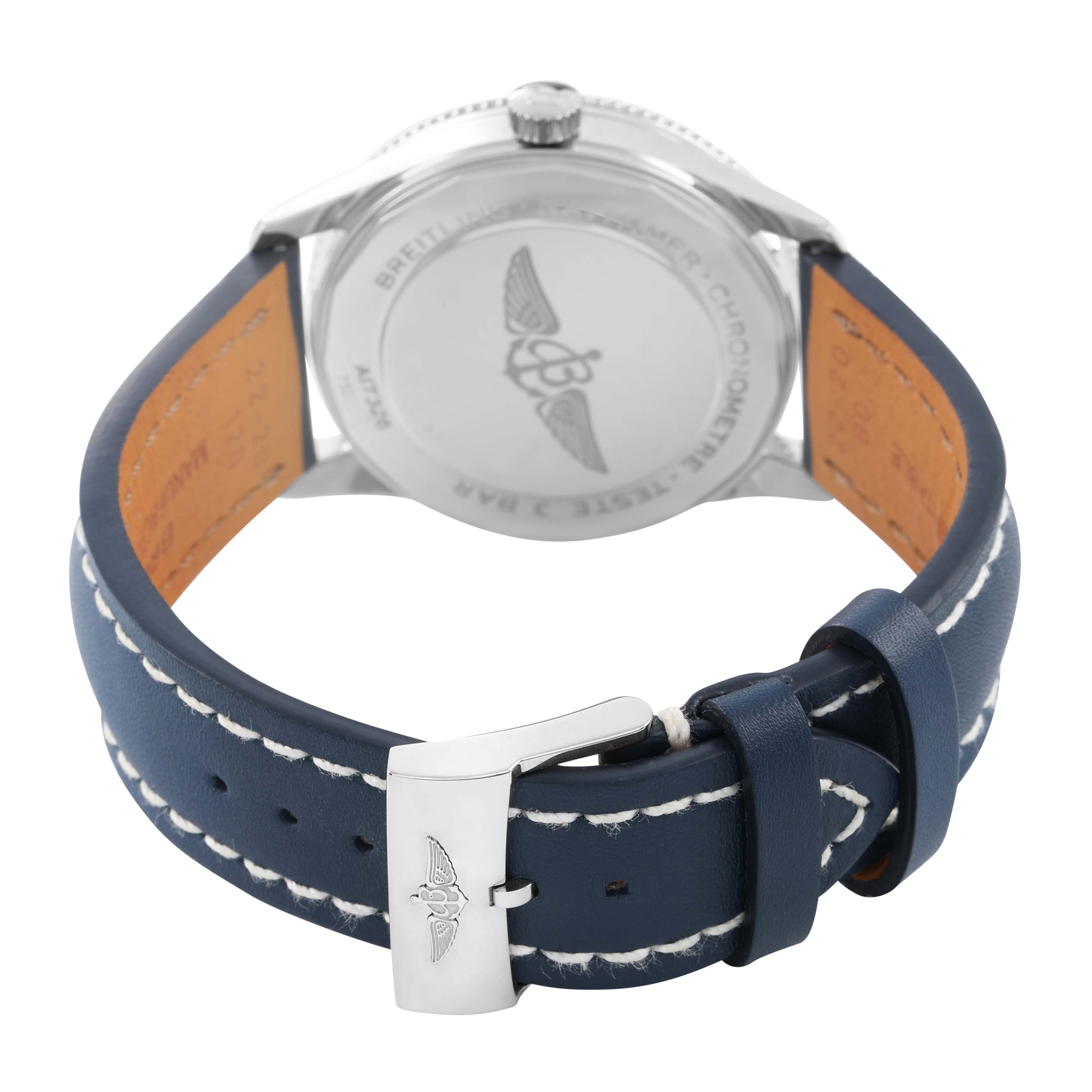 The image shows the back view of a Breitling Navitimer A17326 Men's Stainless Steel Blue Dial watch, focusing on the case back and blue leather strap with stitching.