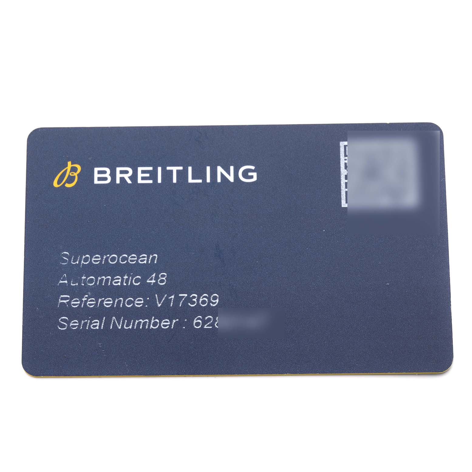 The image shows a Breitling warranty card for the Superocean model, displaying the brand, model, reference, and serial number.