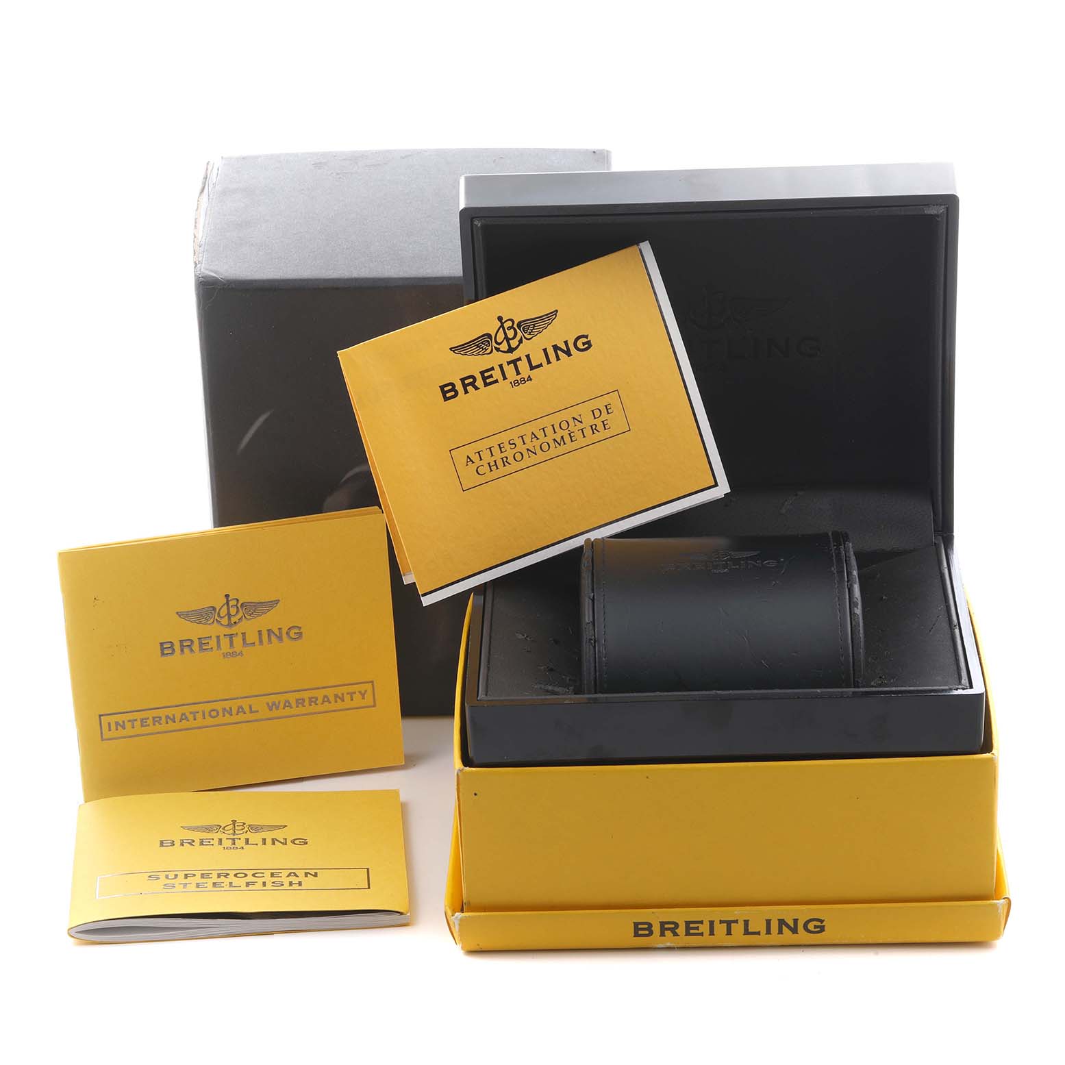 The image shows a Breitling Superocean A1739010/C666 Men's Stainless Steel Blue Dial A1739010/C666 Men's Stainless Steel Blue Dial watch box from a frontal angle, including documents like the warranty and chronometer attestation.