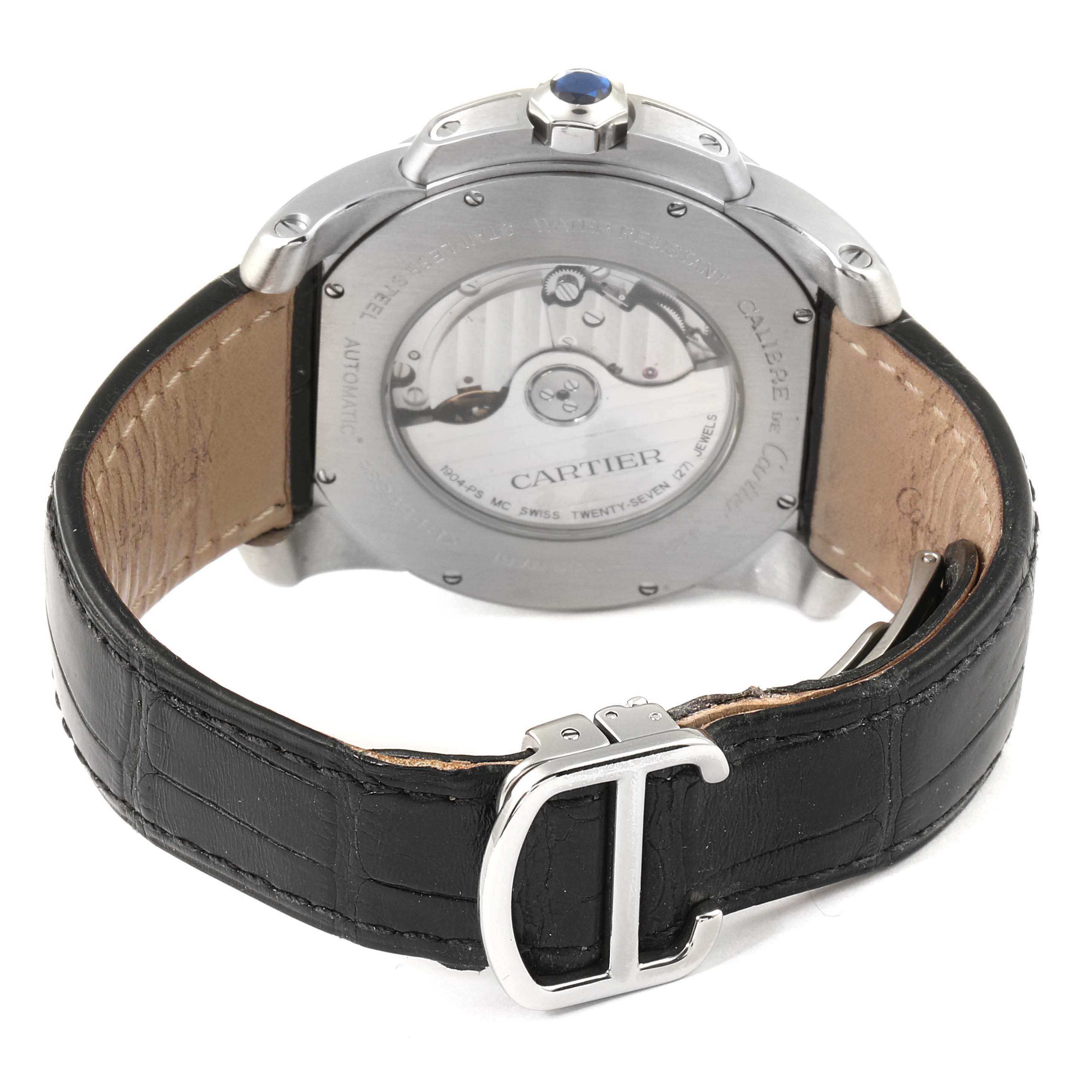 The image shows the back view of a Calibre de Cartier watch by Cartier, highlighting its movement and black leather strap.