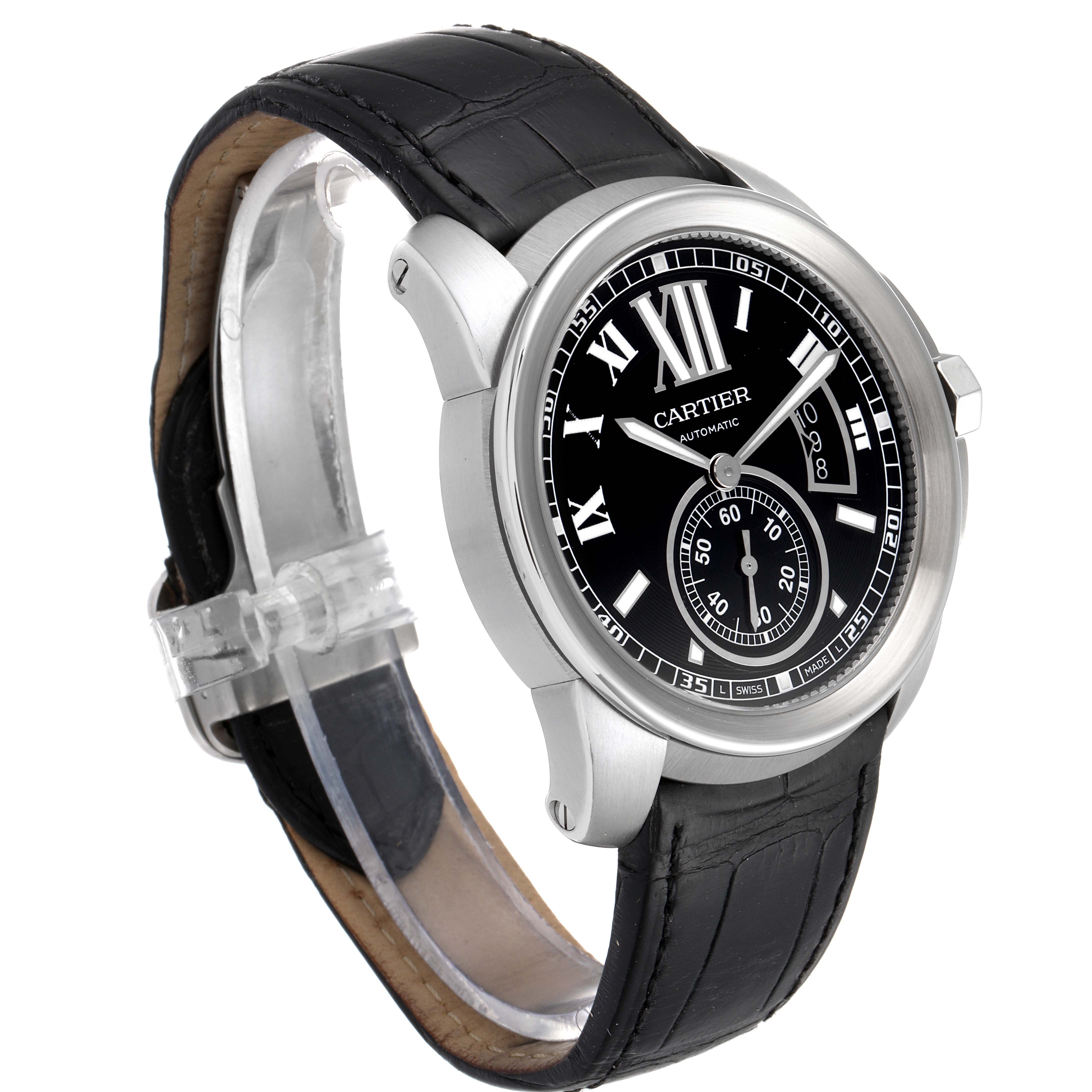 The image shows a Calibre de Cartier watch by Cartier from an angled front view, highlighting the black dial, Roman numerals, and leather strap.