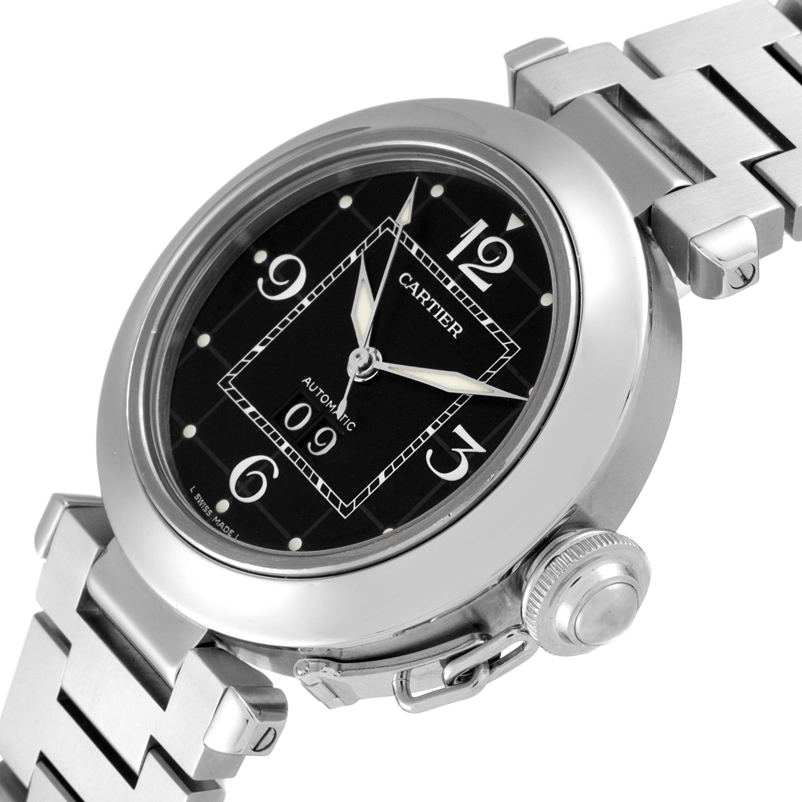 The image shows a close-up of the Cartier Pasha W31053M7 Men's Stainless Steel Black Dial W31053M7 Men's Stainless Steel Black Dial watch focused on the dial, crown, and part of the bracelet.