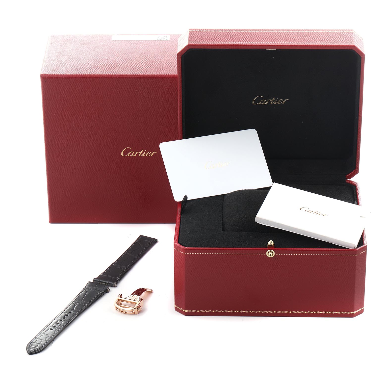 The image shows a Cartier Santos WGSA0031 Men's Rose Gold Silver Dial WGSA0031 Men's Rose Gold Silver Dial watch box with a black strap, rose gold clasp, and accompanying packaging materials.