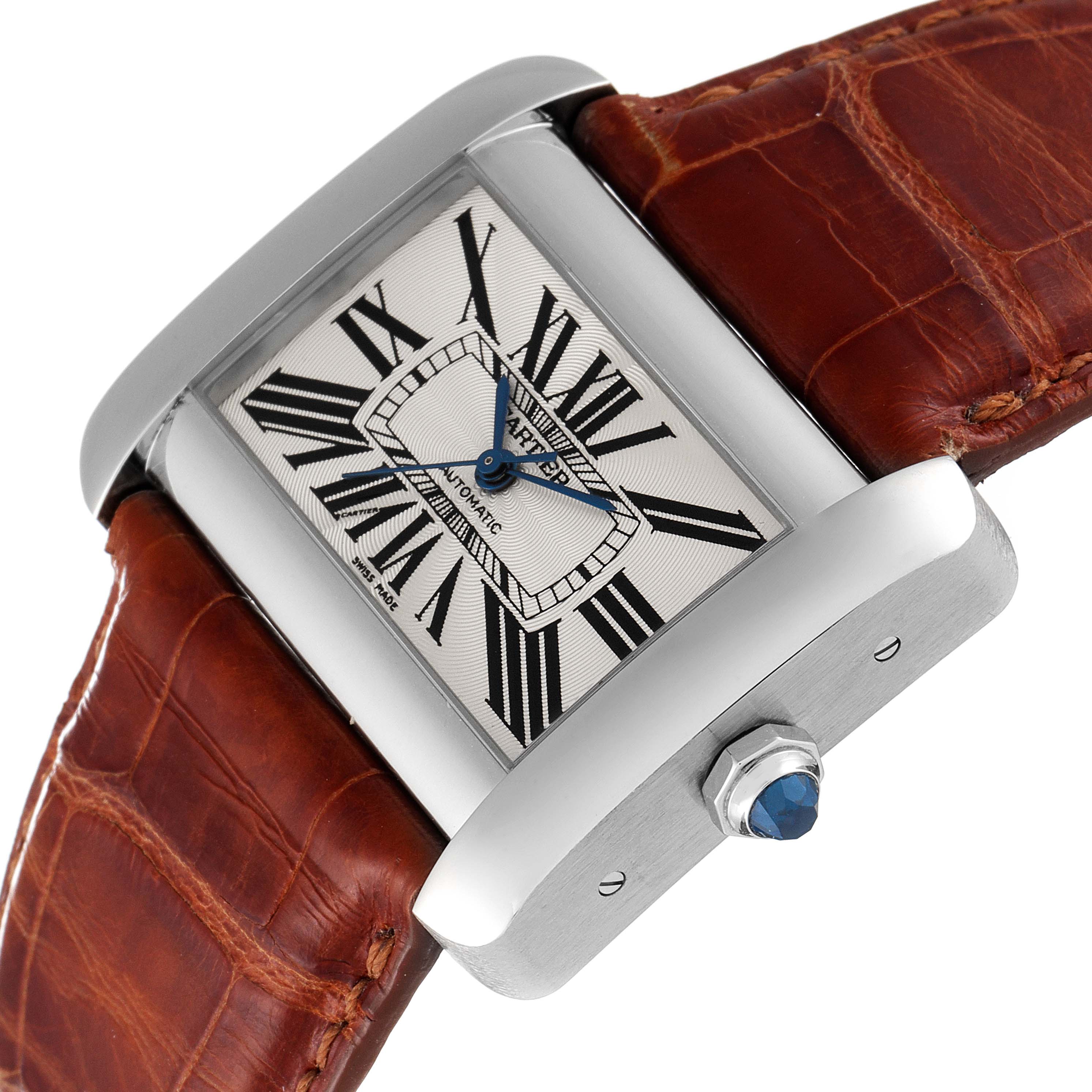 The image shows a Cartier Tank Divan W6300755 Women's Stainless Steel Silver Dial W6300755 Women's Stainless Steel Silver Dial watch, angled to display the face, brown leather strap, and crown with a blue gem.