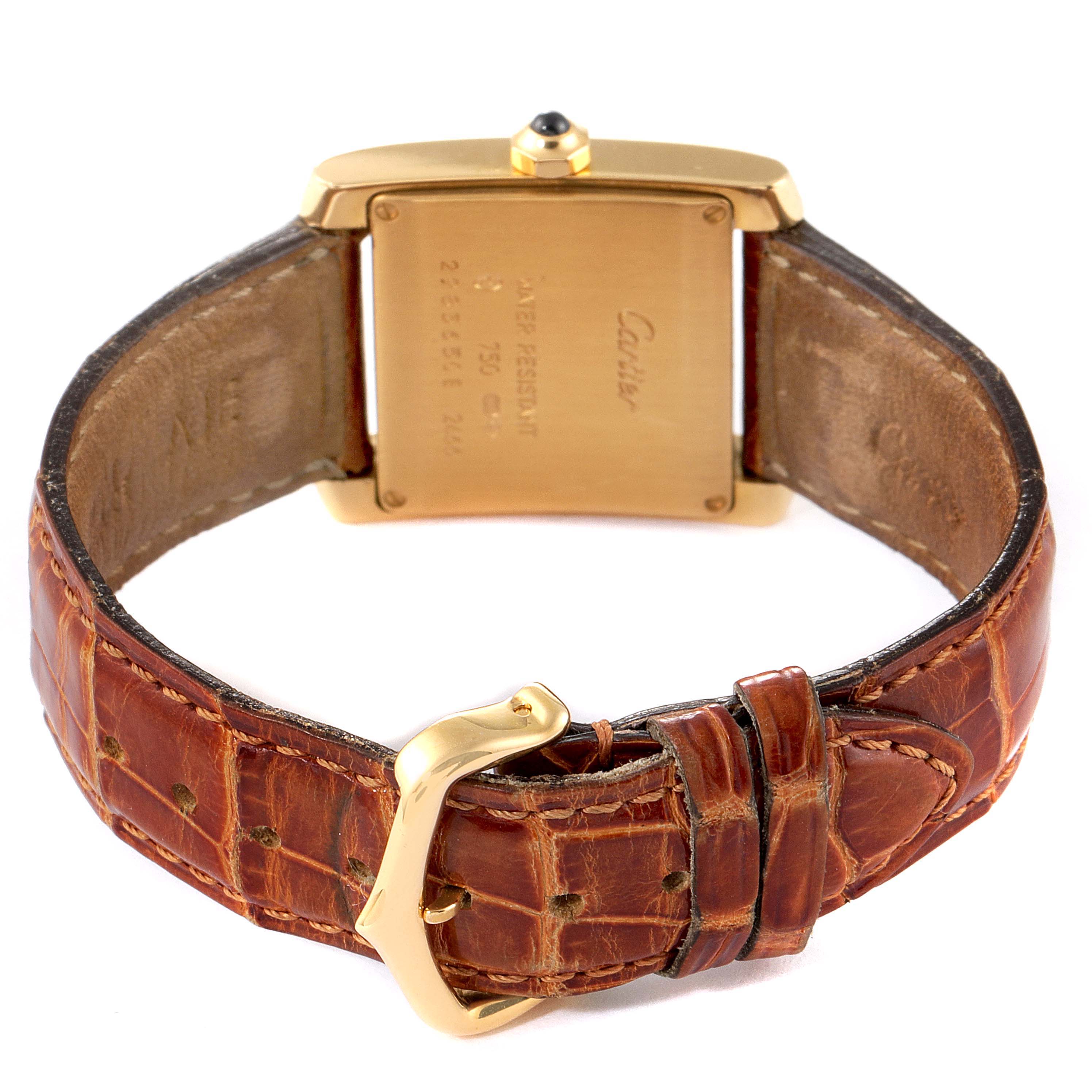 This image shows the back of the Cartier Tank Francaise W50014N2 Women
s Yellow Gold Silver Dial W50014N2 Women
s Yellow Gold Silver Dial watch and its leather strap with a gold buckle.