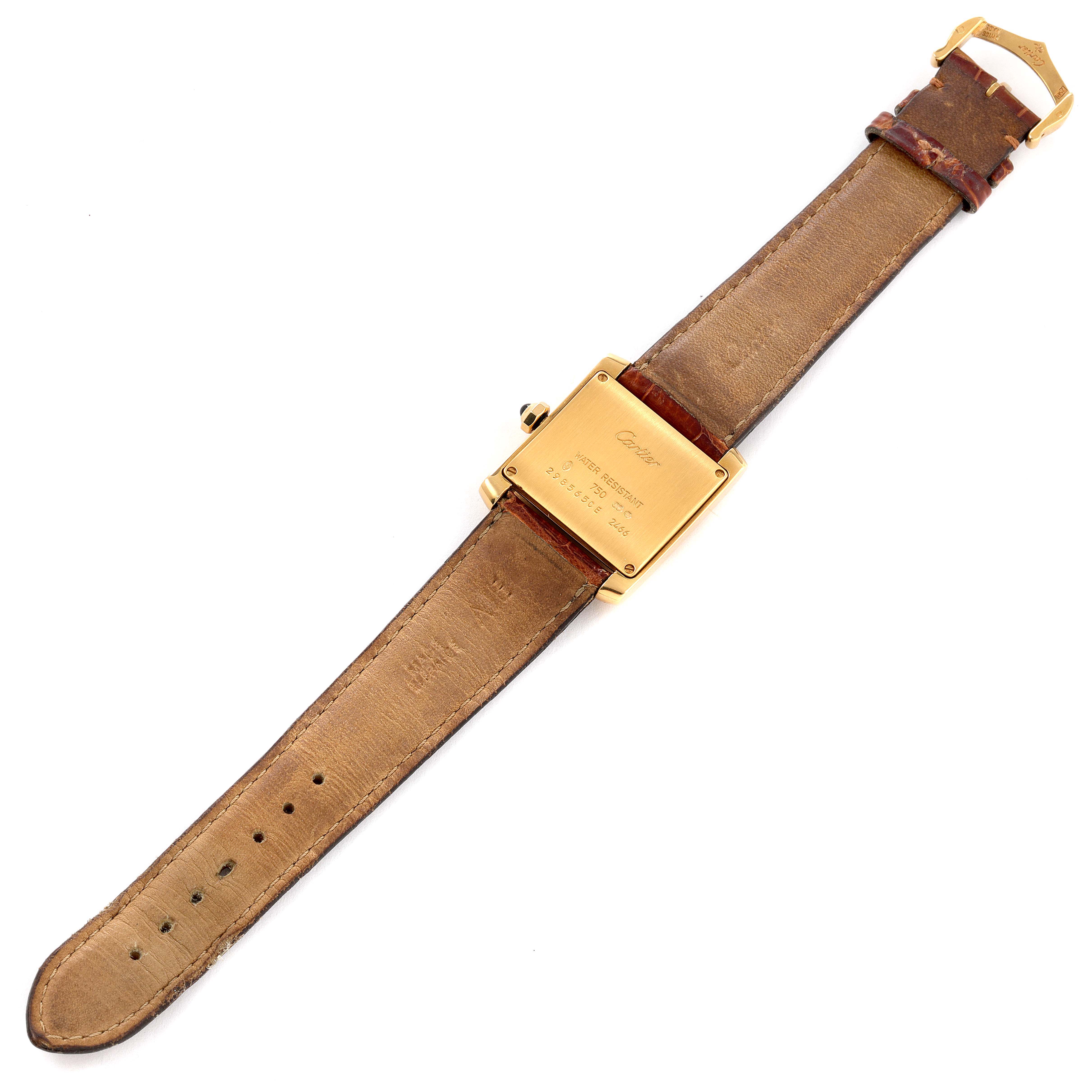 The image shows the back view of a Cartier Tank Française watch, showcasing the case back and leather strap.