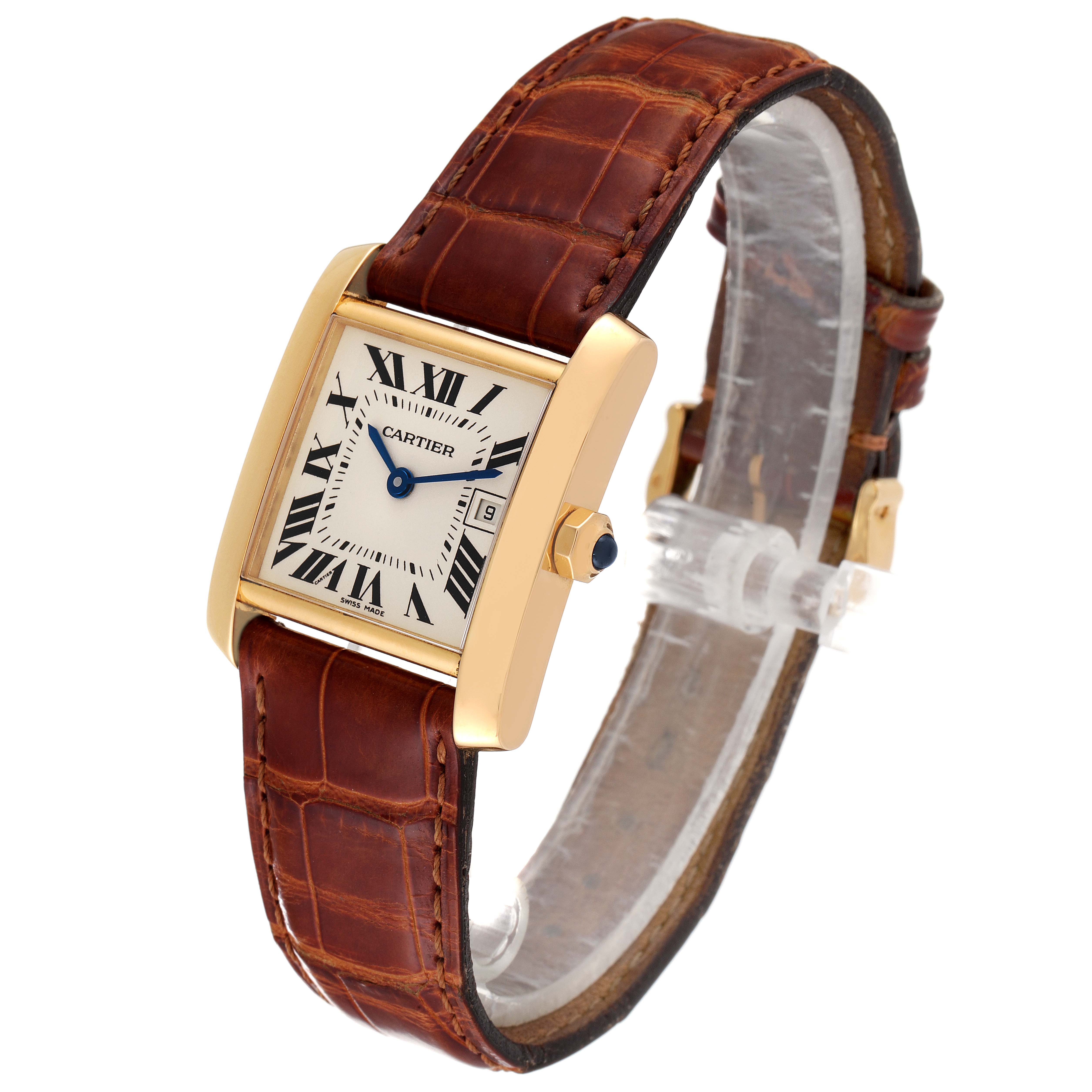 This image shows a Cartier Tank Francaise W50014N2 Women
s Yellow Gold Silver Dial W50014N2 Women
s Yellow Gold Silver Dial watch at a slight angle, highlighting its gold casing, brown leather strap, and Roman numeral dial.