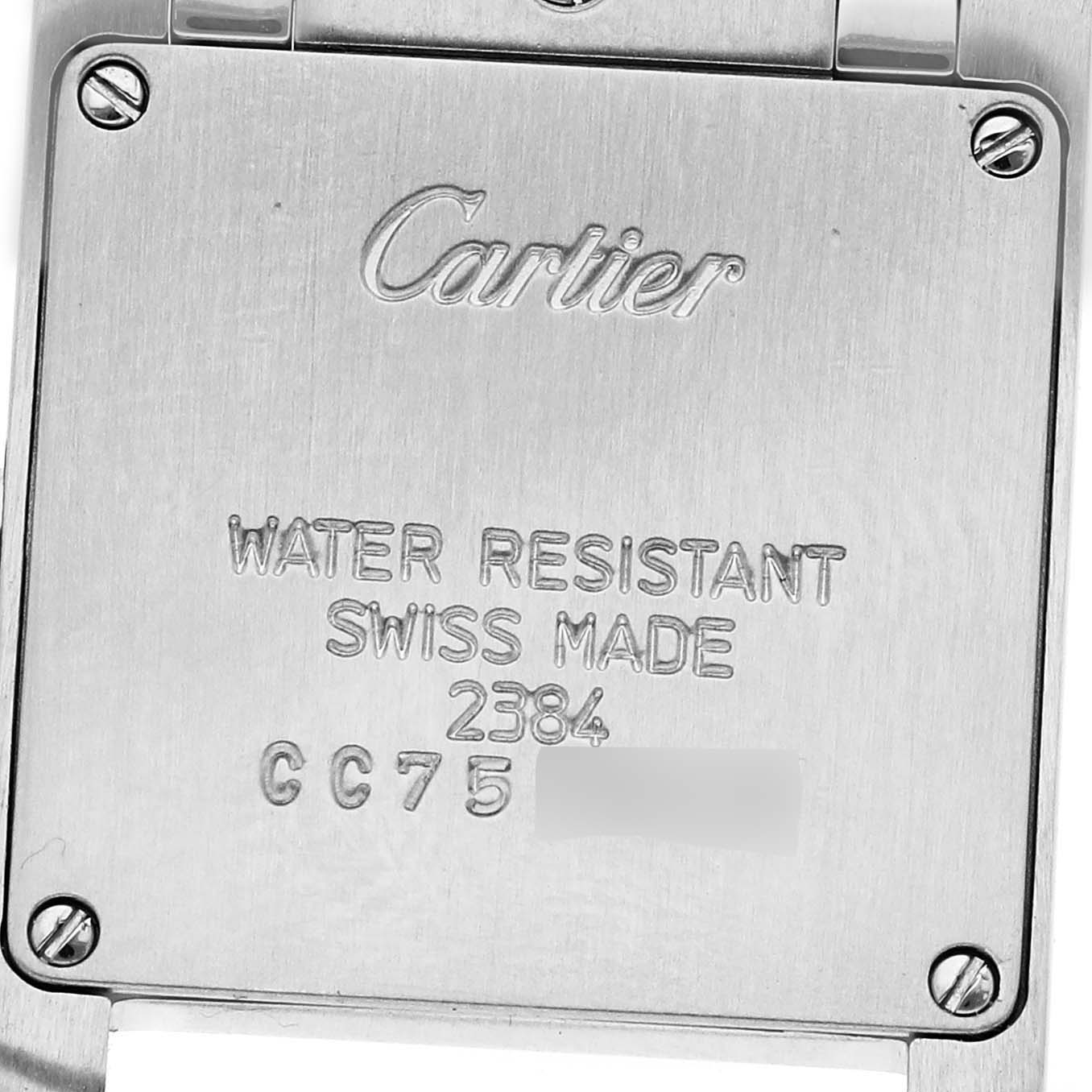 The image shows the back of a Cartier Tank Française watch with engraved details and visible screws.