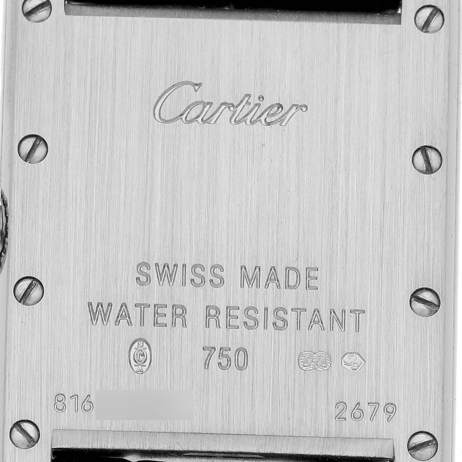 The image shows the case back of a Cartier Tank Louis W1541056 Women's White Gold Silver Dial watch, highlighting engravings and screws.