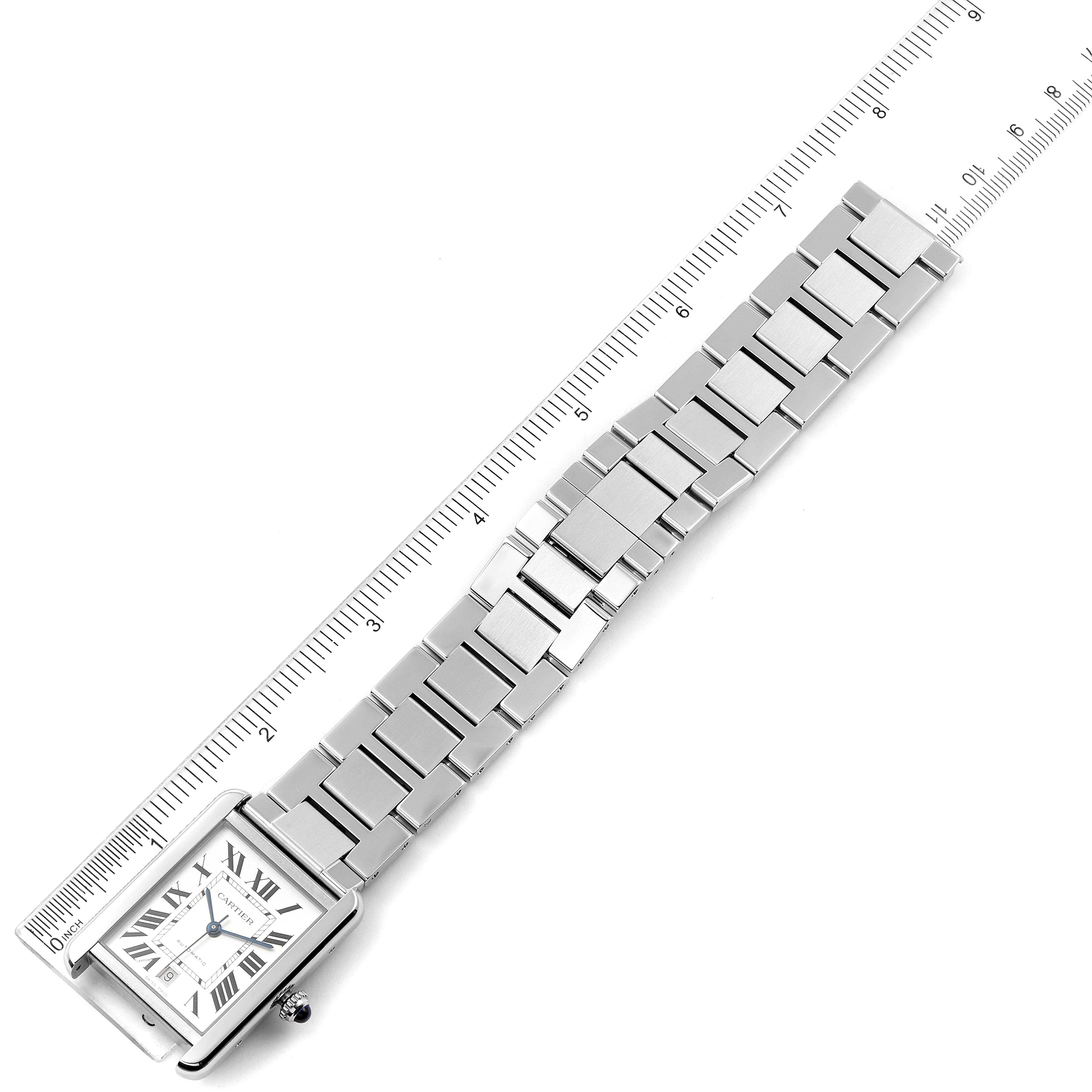 The image shows a Cartier Tank Solo W5200028 Men's Stainless Steel Silver Dial W5200028 Men's Stainless Steel Silver Dial watch at an angled top view, featuring the watch face and metal bracelet next to a ruler.