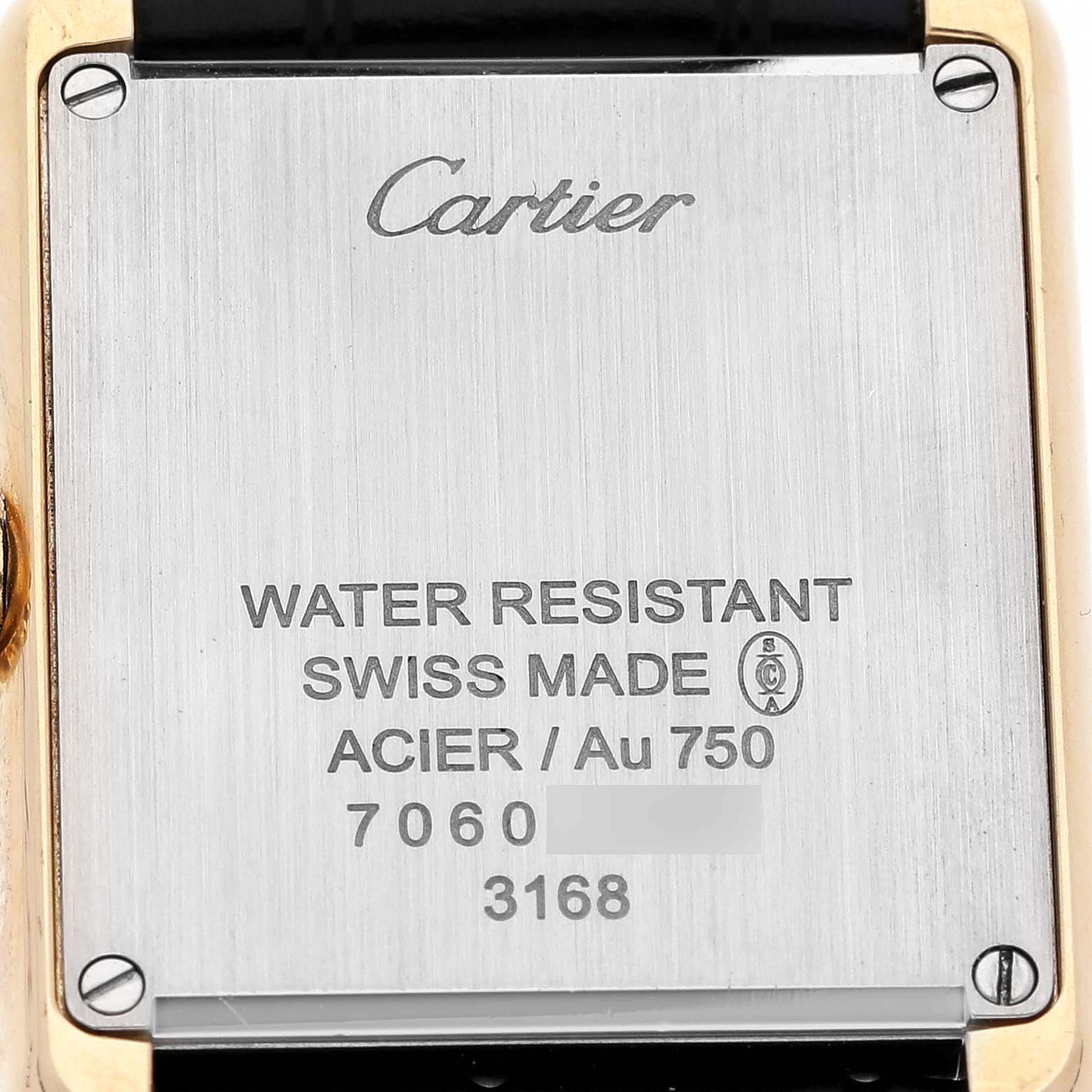 The image shows the back case of a Cartier Tank Solo W5200002 Women's Yellow Gold Silver Dial watch, detailing water resistance and material information.