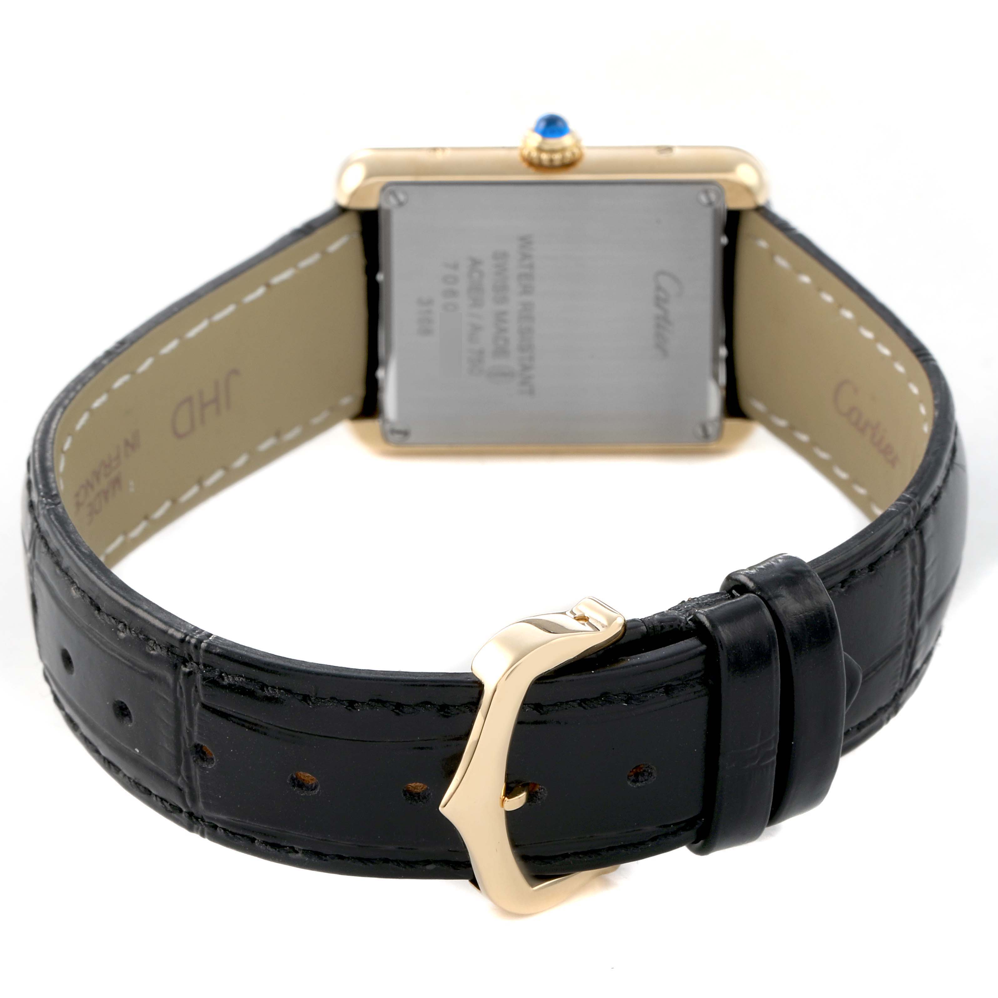 The Cartier Tank Solo W5200002 Women's Yellow Gold Silver Dial watch is shown from the rear, displaying its leather strap, buckle, and case back with a crown detail.