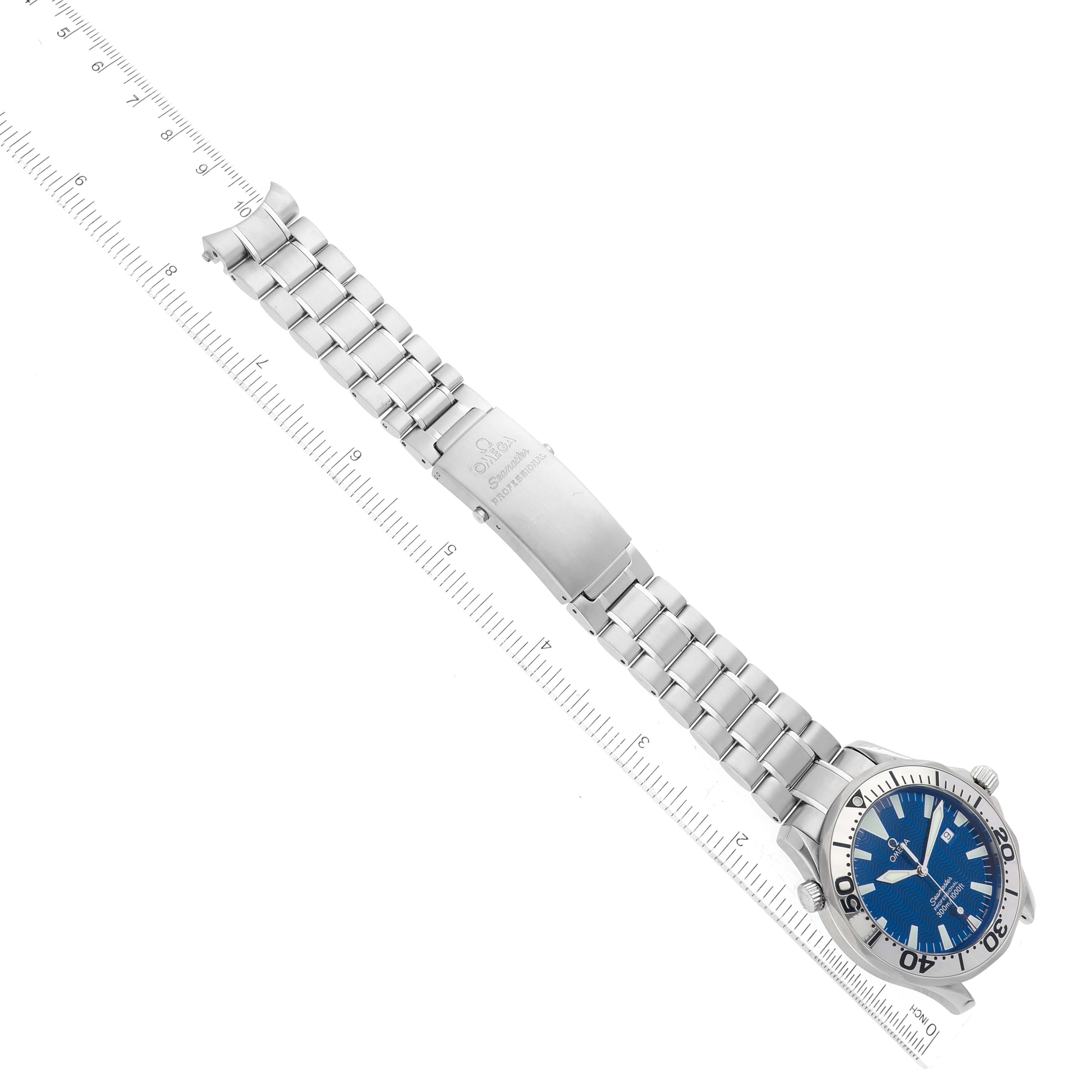 The image shows an overhead view of the Omega Seamaster 2265.80.00 Men
s Stainless Steel Blue Dial 2265.80.00 Men
s Stainless Steel Blue Dial watch, highlighting its blue dial, bezel, and metal bracelet with clasp.