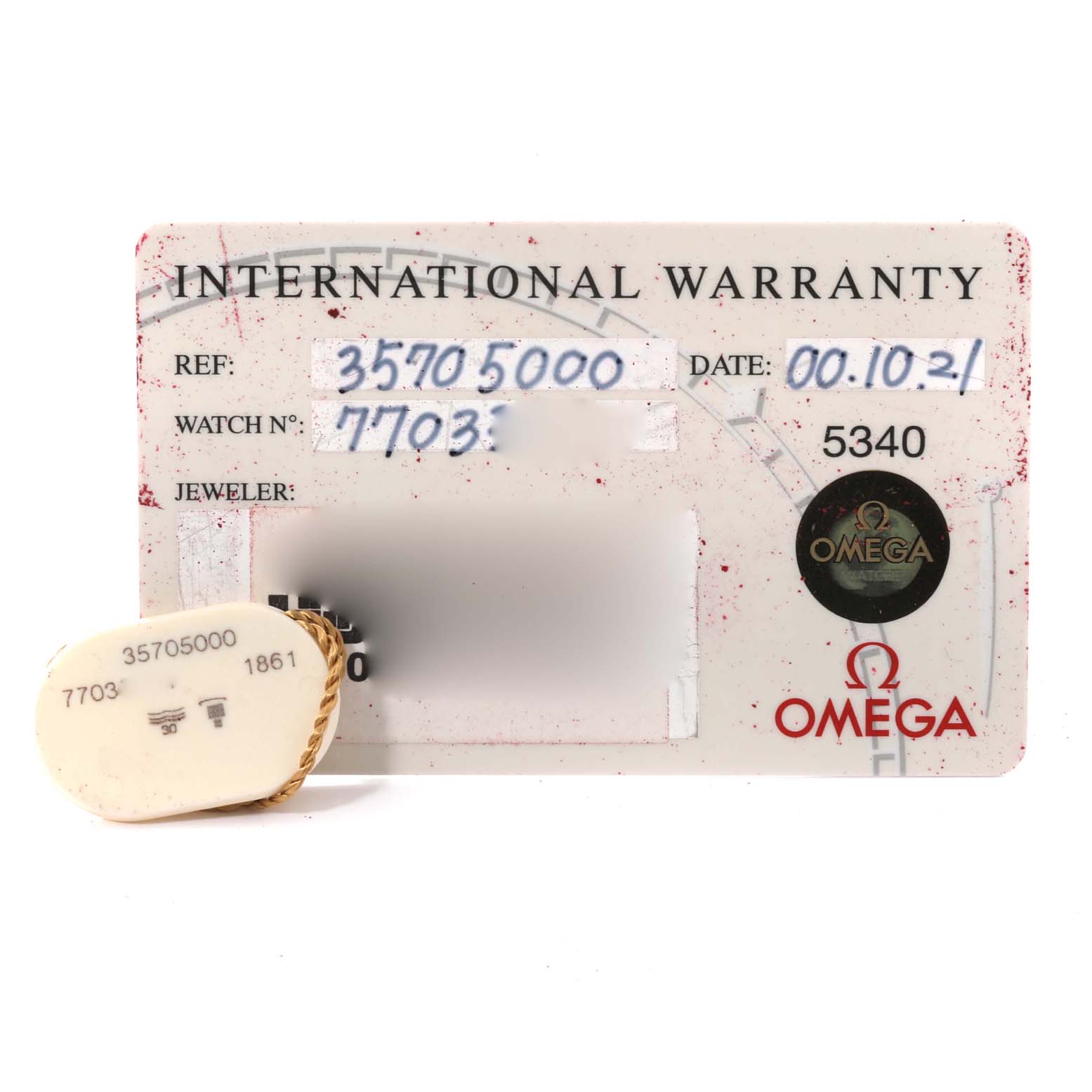 The image shows the international warranty card and tag of an Omega Speedmaster 3570.50.00 Men
s Stainless Steel Black Dial 3570.50.00 Men
s Stainless Steel Black Dial watch.