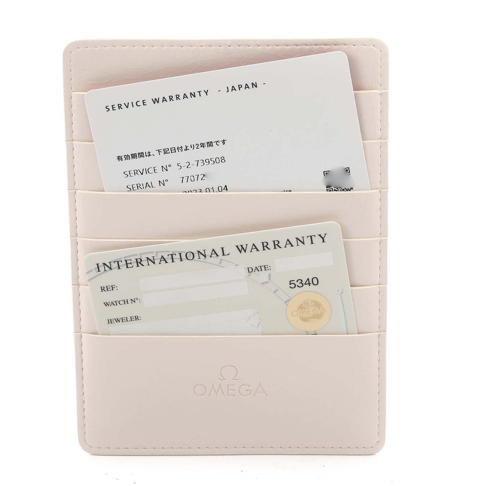 The image shows Omega Speedmaster 3572.50.00 Men
s Stainless Steel Black Dial 3572.50.00 Men
s Stainless Steel Black Dial warranty cards in a beige cardholder with the Omega logo visible.