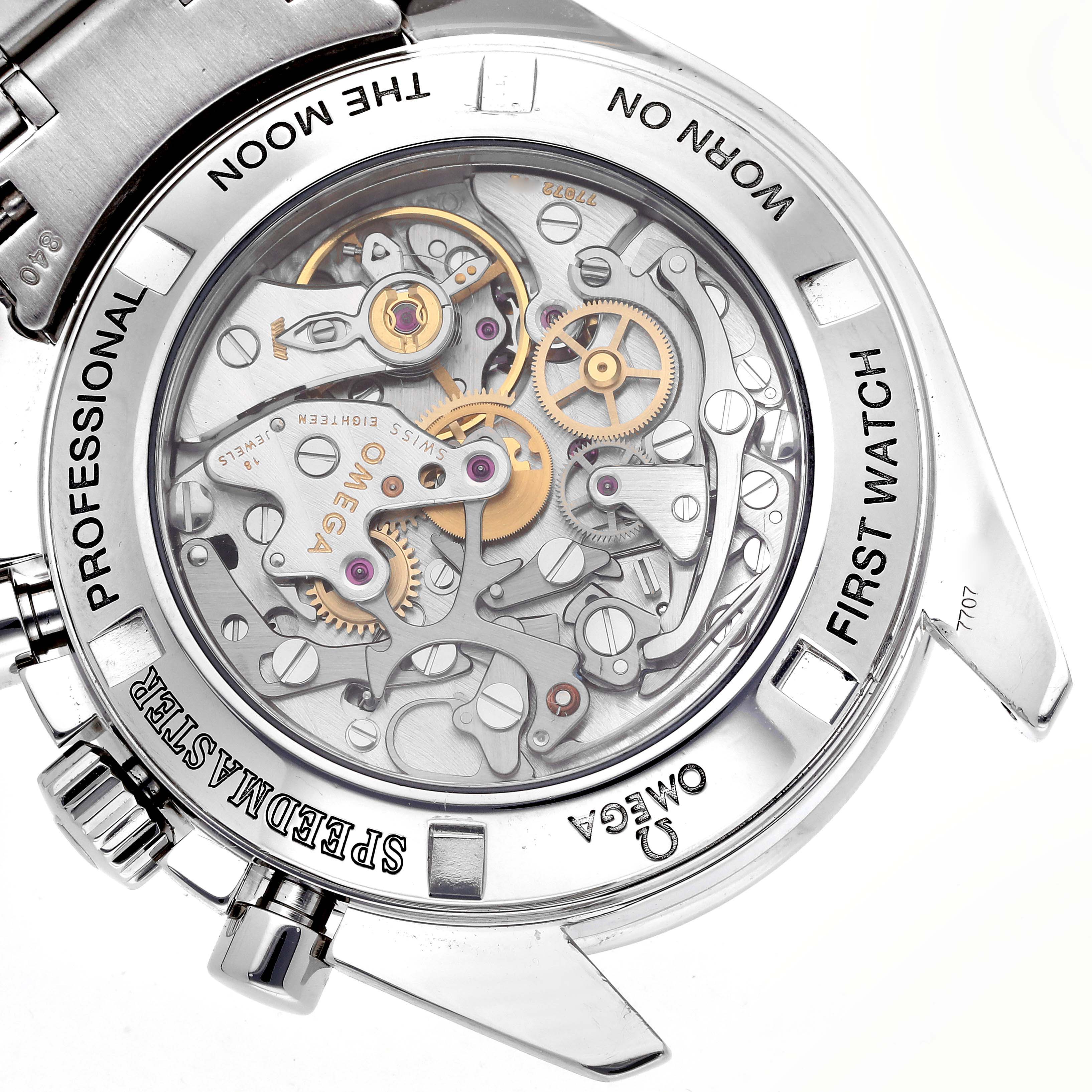 The image shows the back of an Omega Speedmaster 3572.50.00 Men
s Stainless Steel Black Dial 3572.50.00 Men
s Stainless Steel Black Dial watch, highlighting its intricate mechanics and movement.