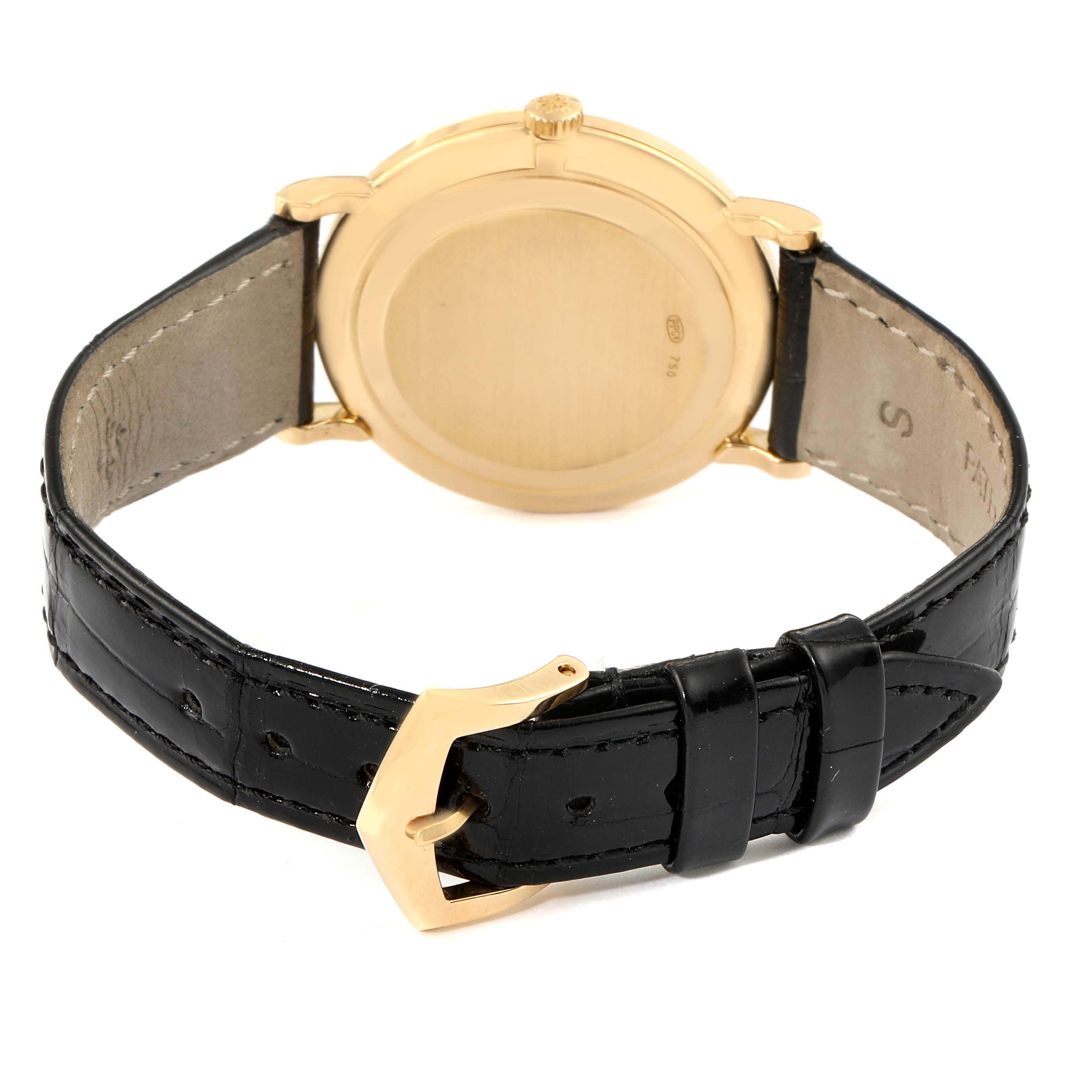 The image shows the back view of the Patek Philippe Calatrava 5022R Men's Rose Gold Pink Dial 5022R Men's Rose Gold Pink Dial watch, focusing on the case back and leather strap with buckle.