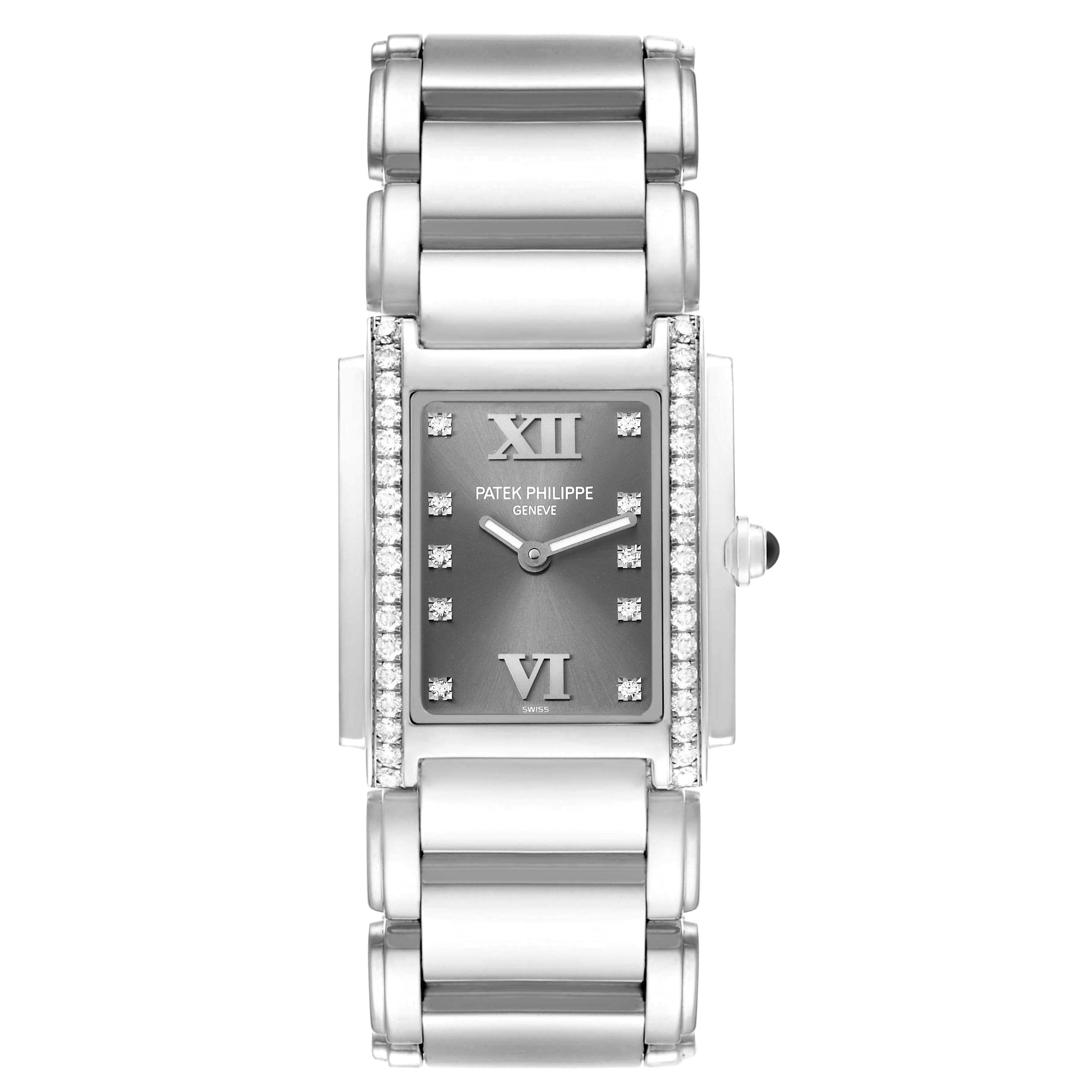The Patek Philippe Twenty-4 4910/10A-010 Women's Stainless Steel Grey Dial watch is shown from a top-down angle, highlighting its rectangular face, diamond accents, and bracelet.