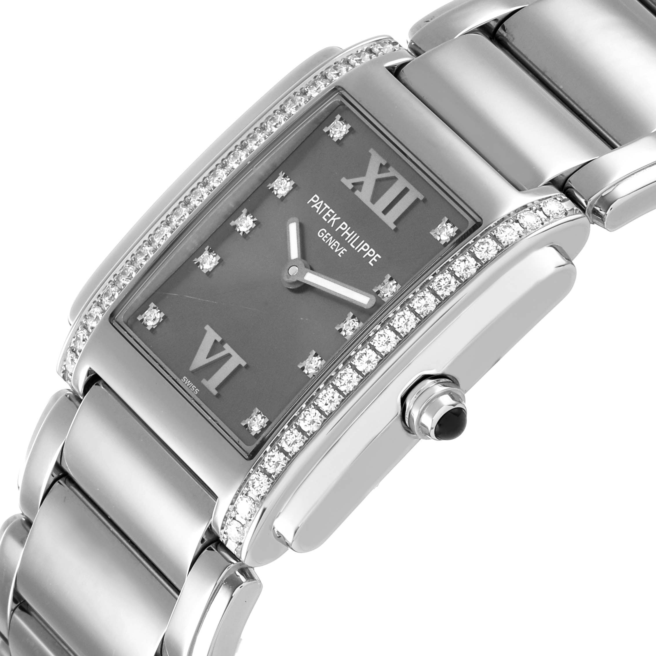 The image shows a Patek Philippe Twenty-4 4910/10A-010 Women's Stainless Steel Grey Dial watch from an angled side view, highlighting its diamond-accented bezel and stainless steel bracelet.