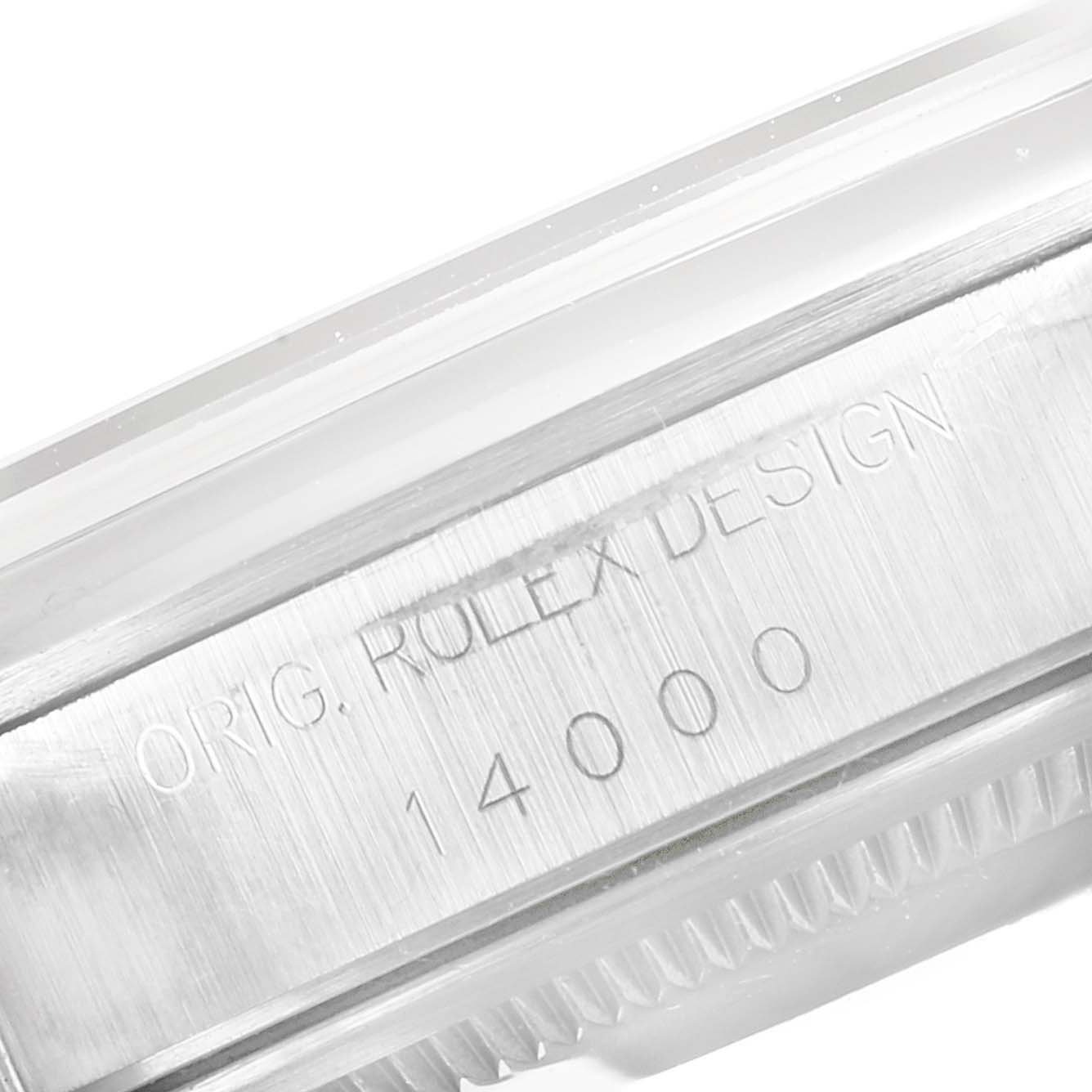 This is a close-up of the side of the Rolex Air-King 14000 Men's Stainless Steel Silver Dial 14000 Men's Stainless Steel Silver Dial watch case showing the model number "14000" and "Orig. Rolex Design" engraving.