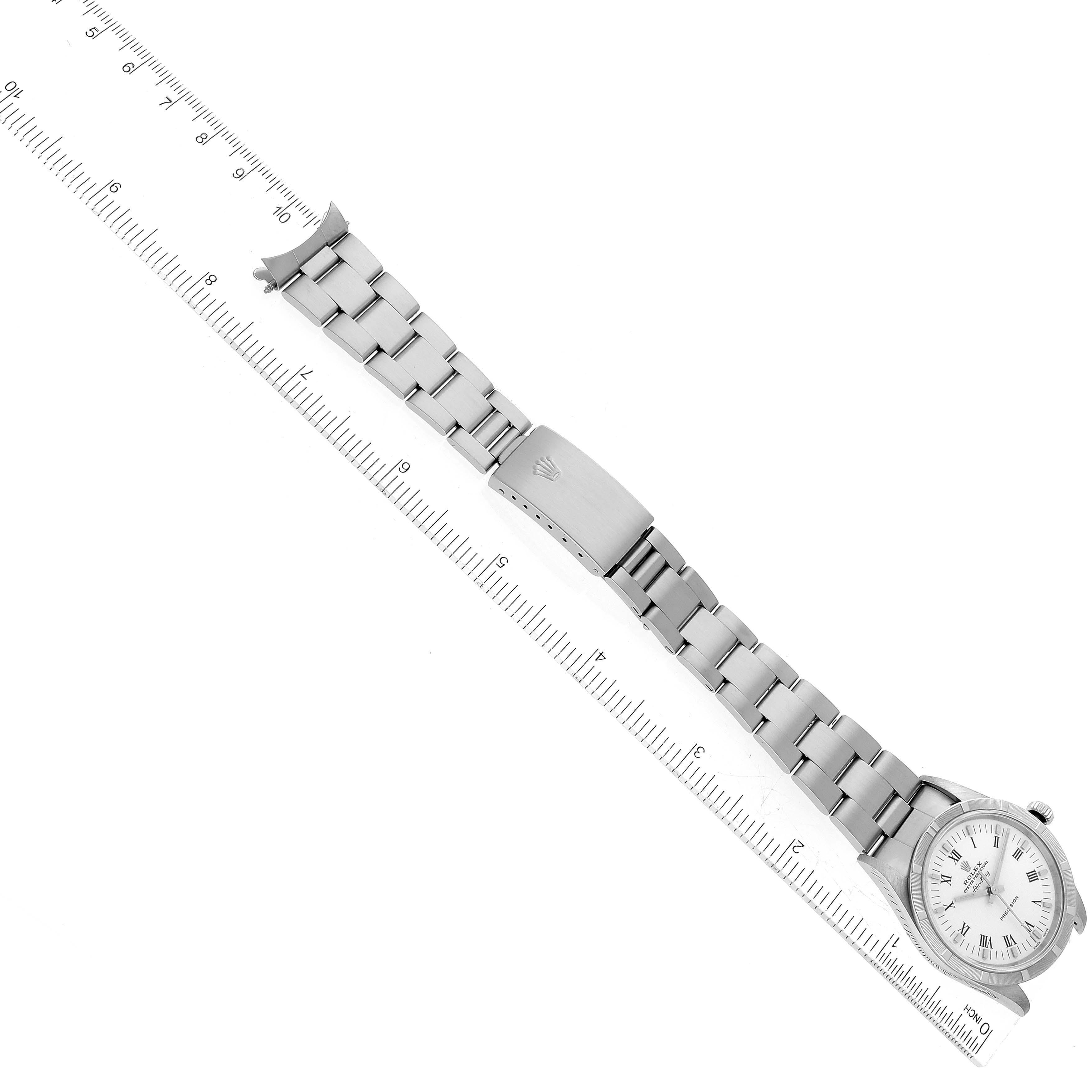 The image shows a Rolex Air-King 14010 Men's Stainless Steel White Dial 14010 Men's Stainless Steel White Dial watch laid flat with its bracelet and clasp fully extended, next to a ruler for scale.