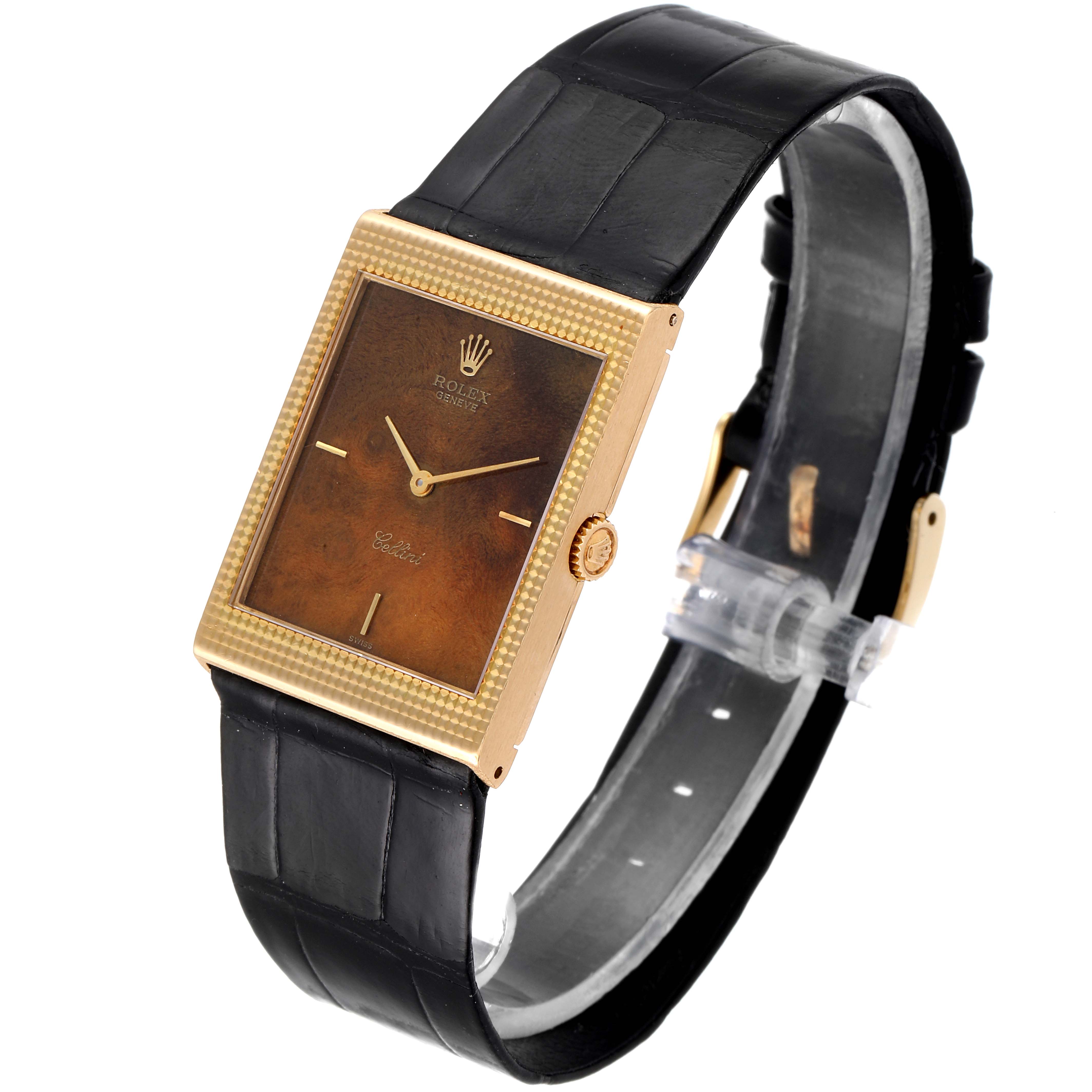 This image shows a Rolex Cellini 4127 Men's Yellow Gold Brown Dial 4127 Men's Yellow Gold Brown Dial watch from an angled side view, featuring its rectangular dial and black leather strap.
